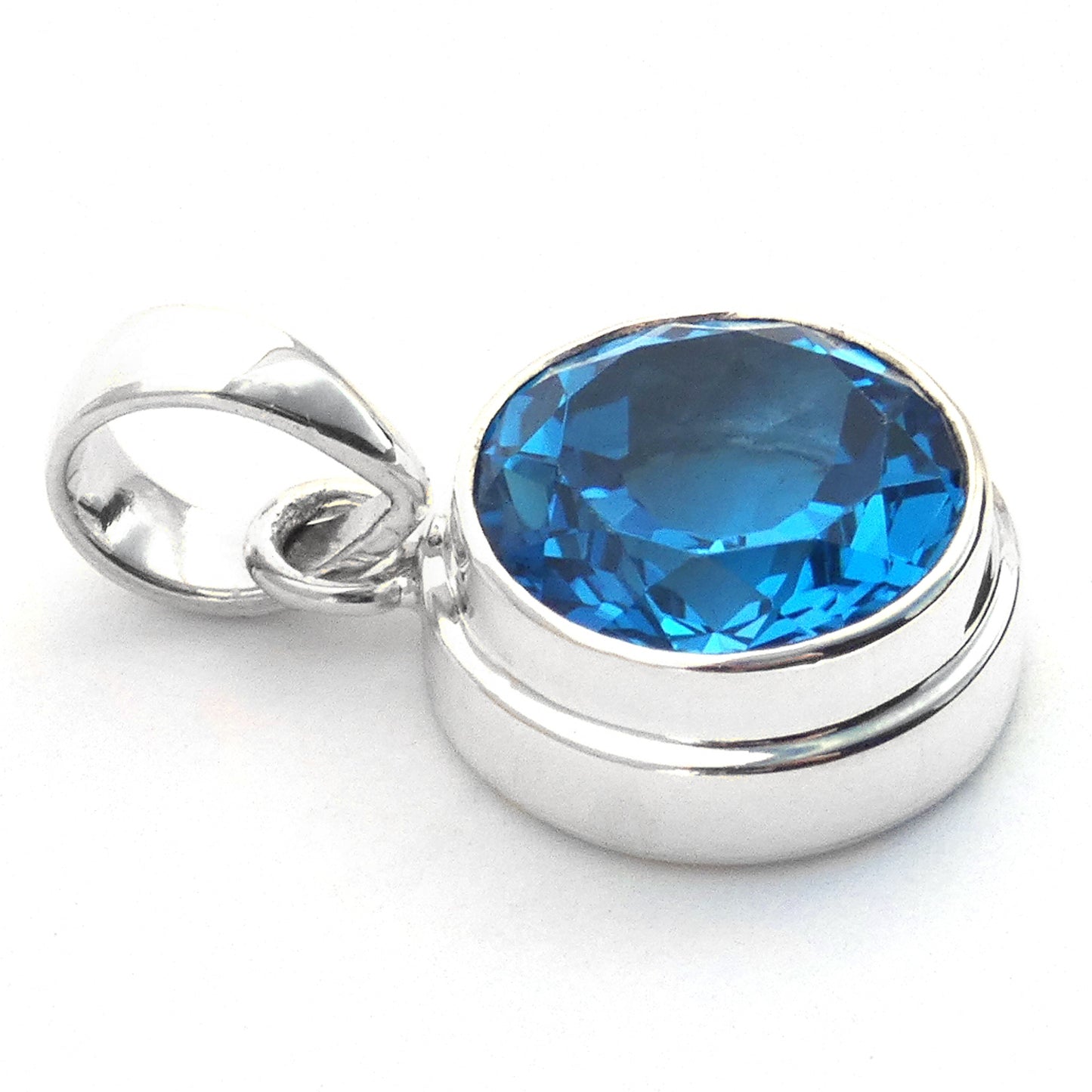 Sterling silver and Swiss blue topaz round pendant.