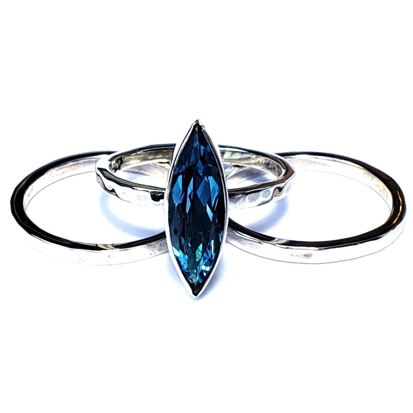 Sterling silver ring set with Swiss blue topaz marquis cut gemstone.