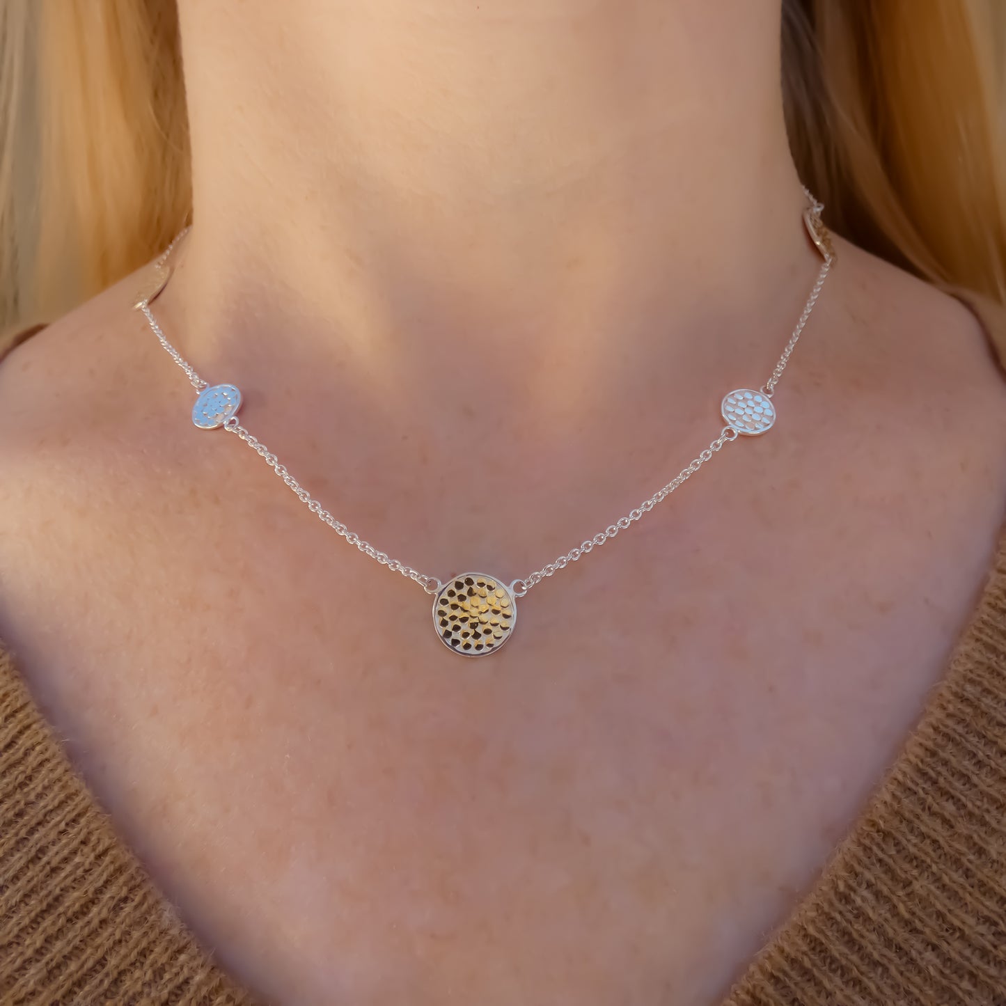 Sterling silver and gold necklace with lightweight chain and dotted discs.