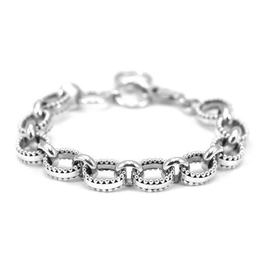 Silver oval link bracelet with granulated beads and polished ring connectors.