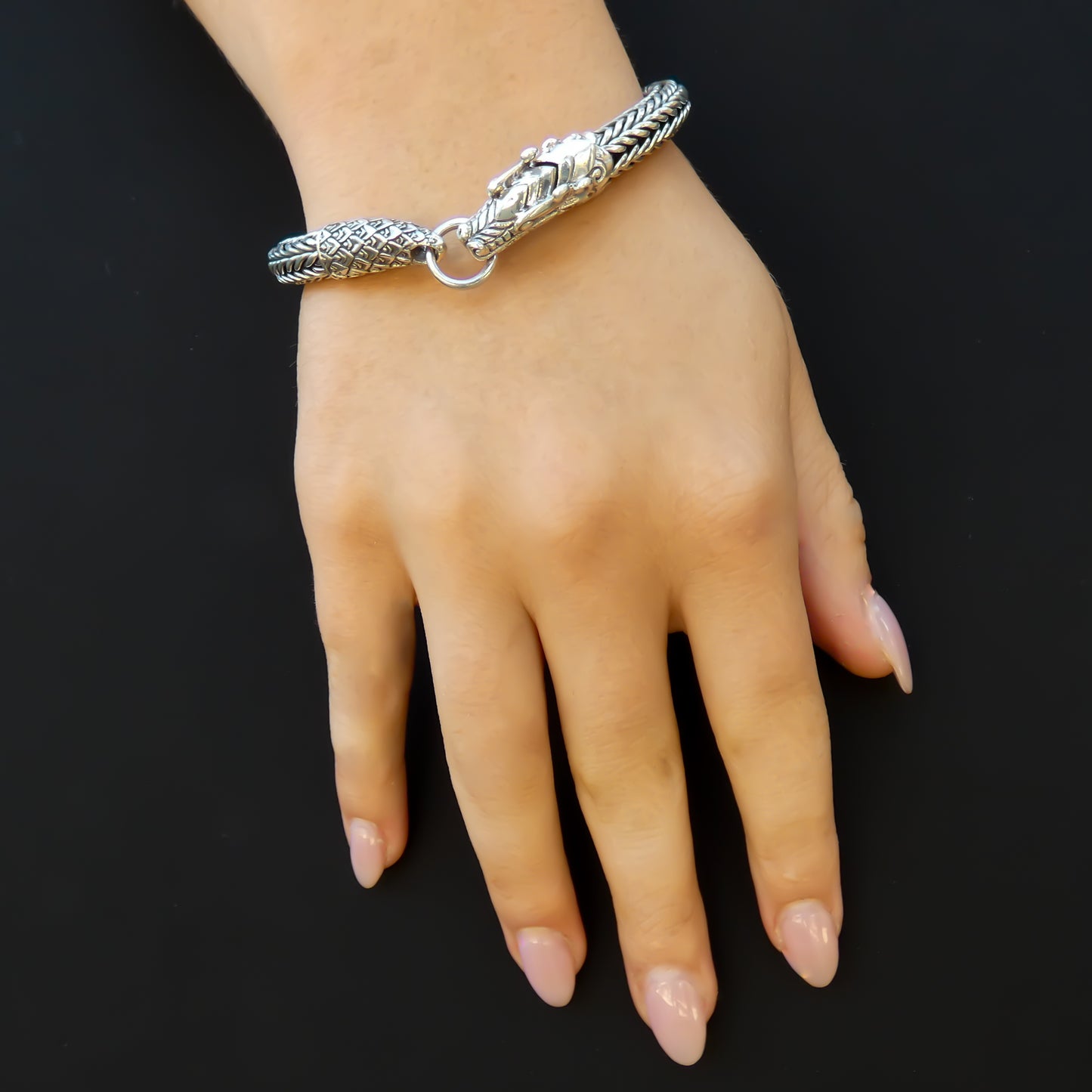 Sterling silver chain bracelet with dragon clasp.