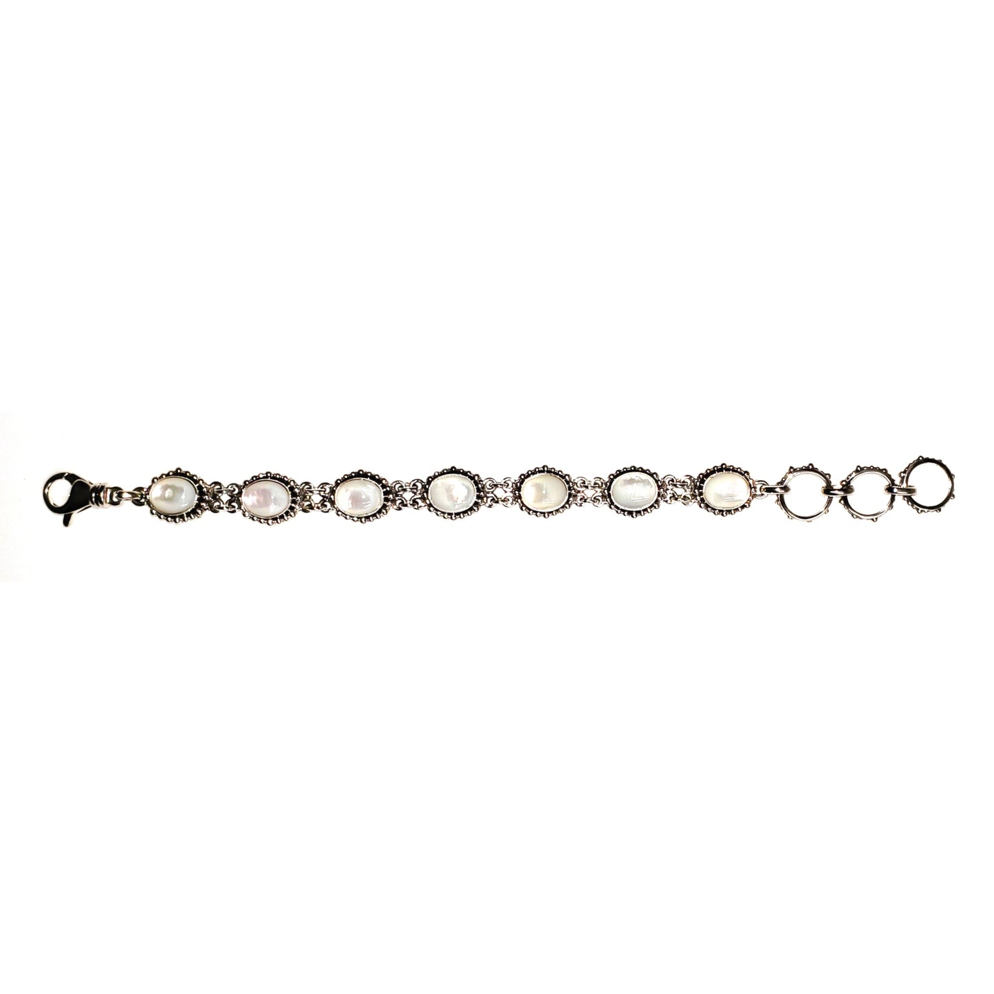 Silver mother of pearl link bracelet laid out straight.