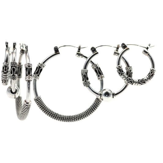 Set of 3 sterling silver hoop earrings.