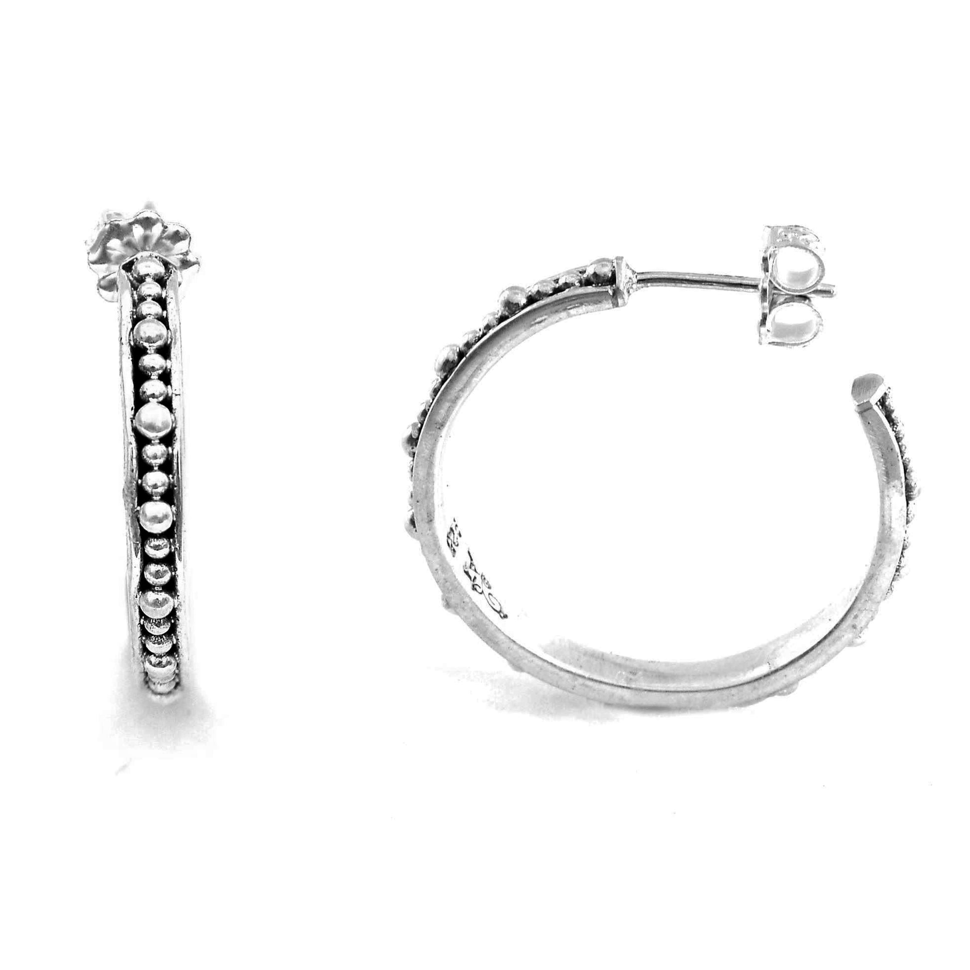 Sterling silver beaded hoops.