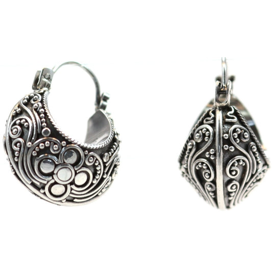 Sterling silver huggie filigree motif earrings.