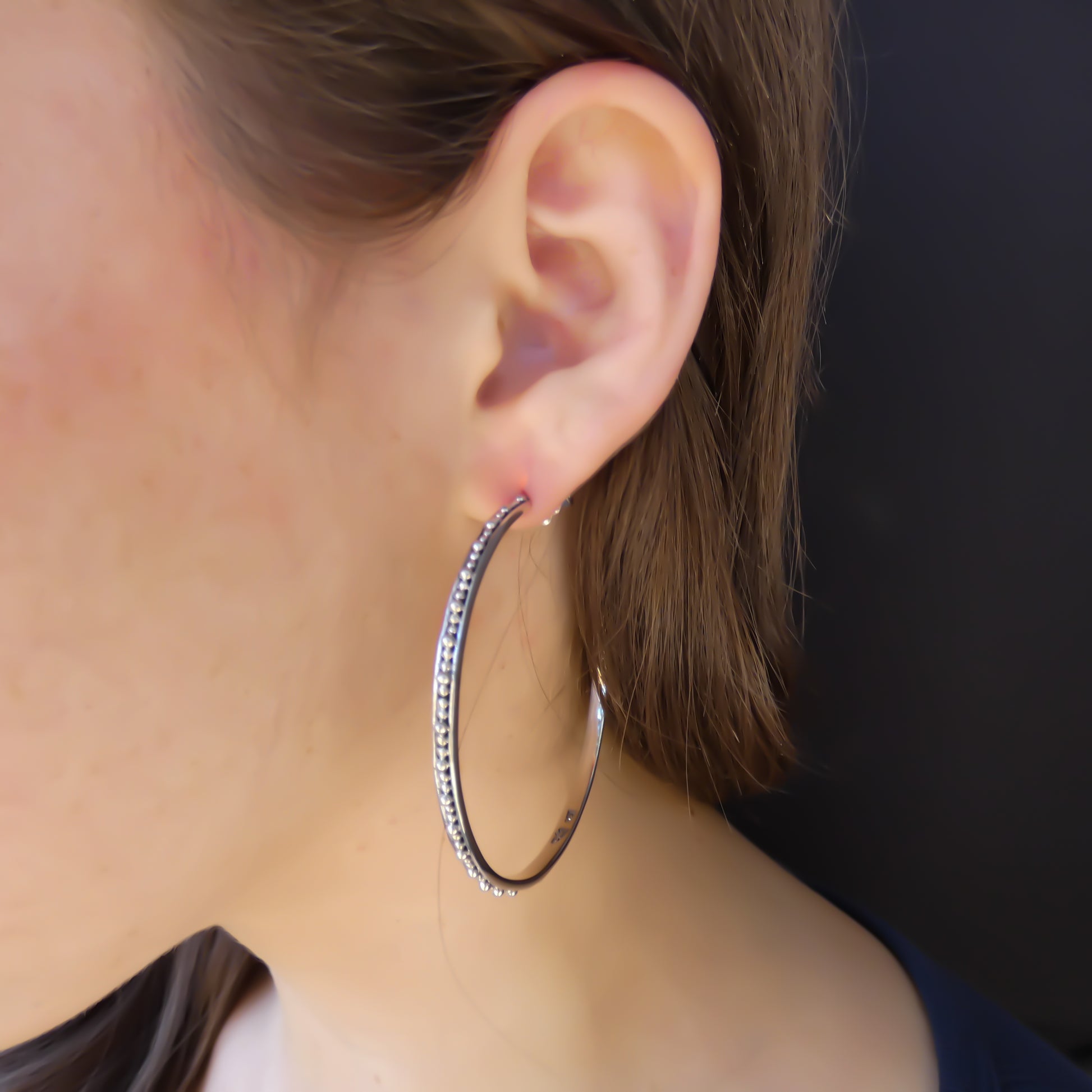 Sterling silver large beaded hoops.