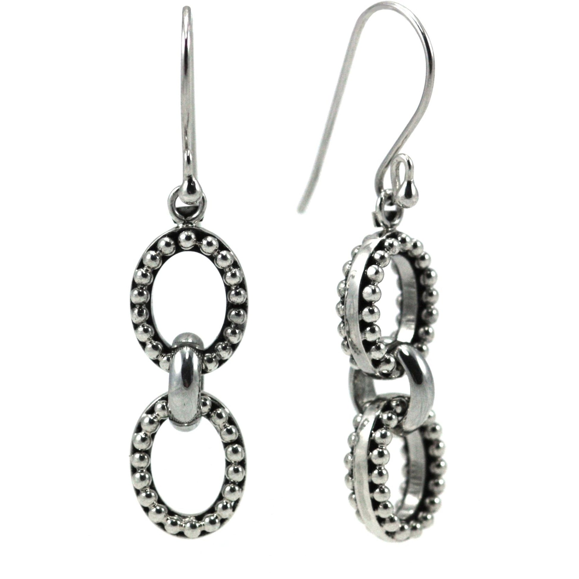 Silver earrings with double oval beaded drop elements.
