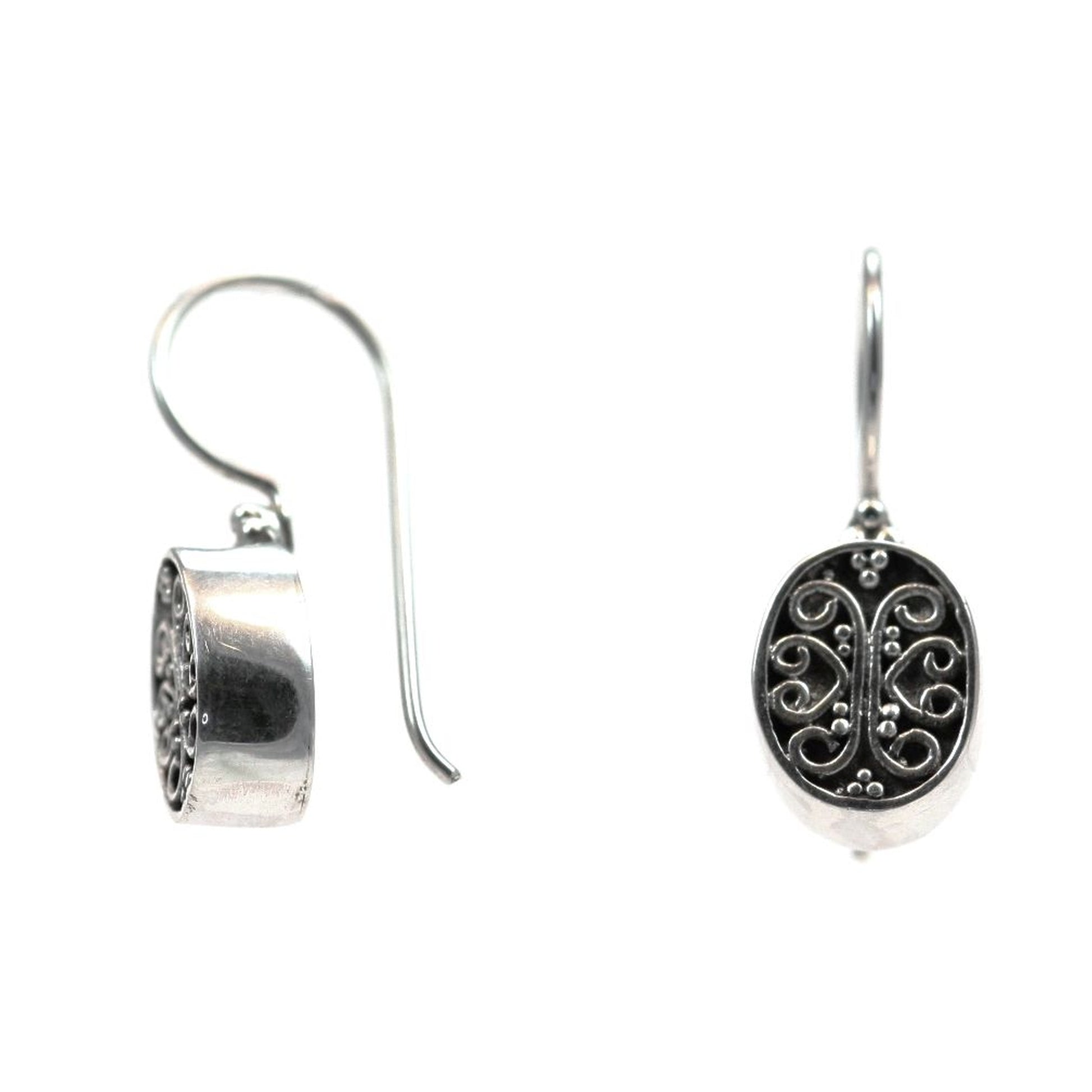 Sterling silver wire dangle oval earrings.