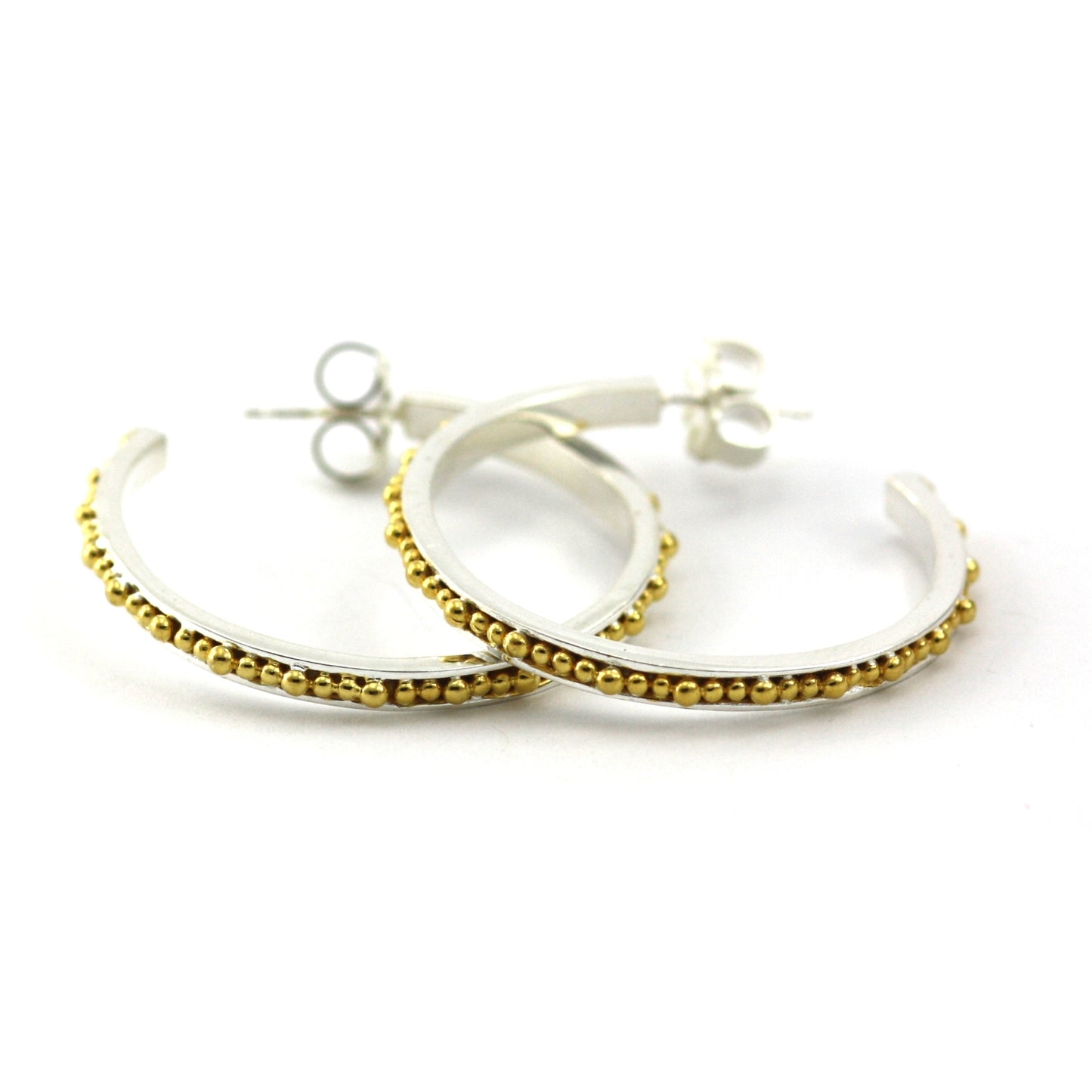 Sterling silver and gold beaded hoops.