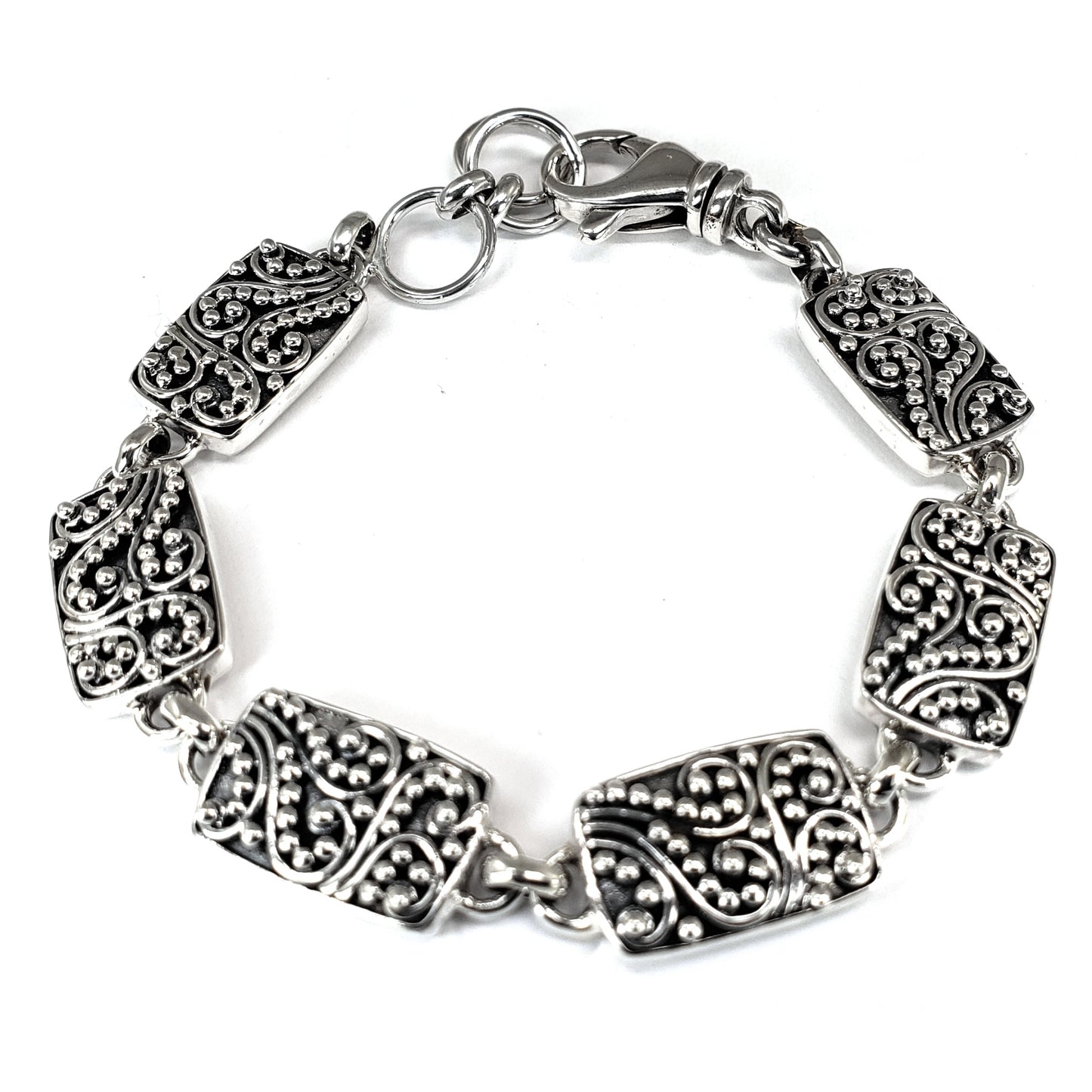 Sterling silver filigree link bracelet.
