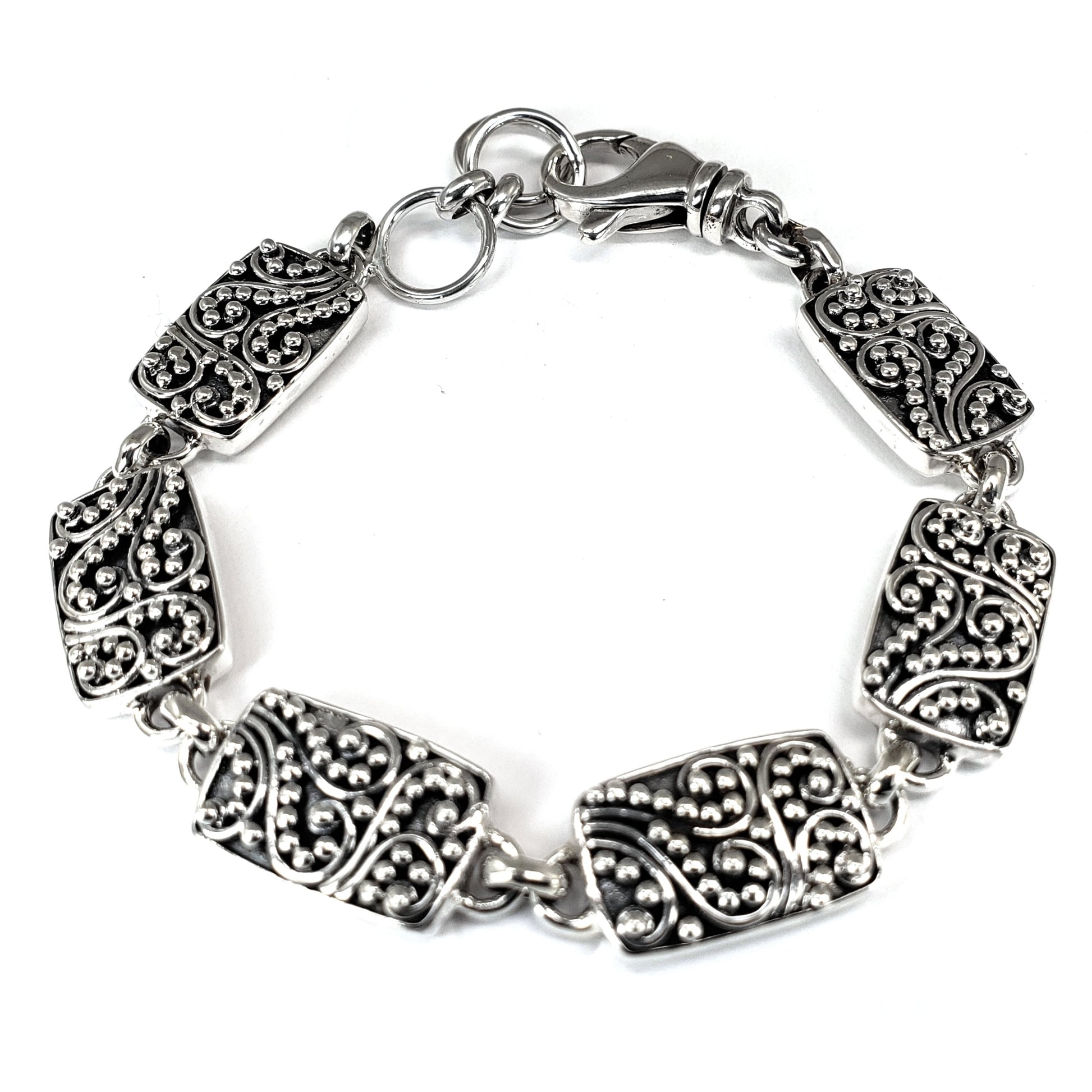 Sterling silver filigree link bracelet.