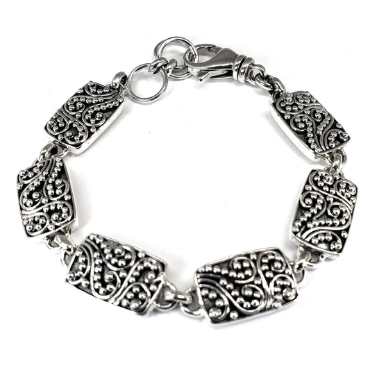 Sterling silver filigree link bracelet.