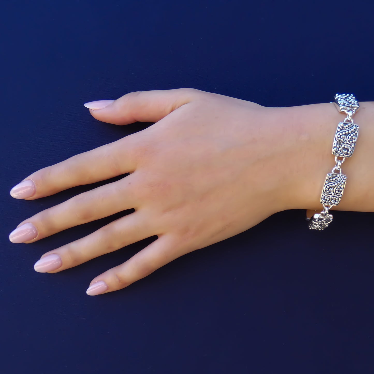 Sterling silver filigree link bracelet.