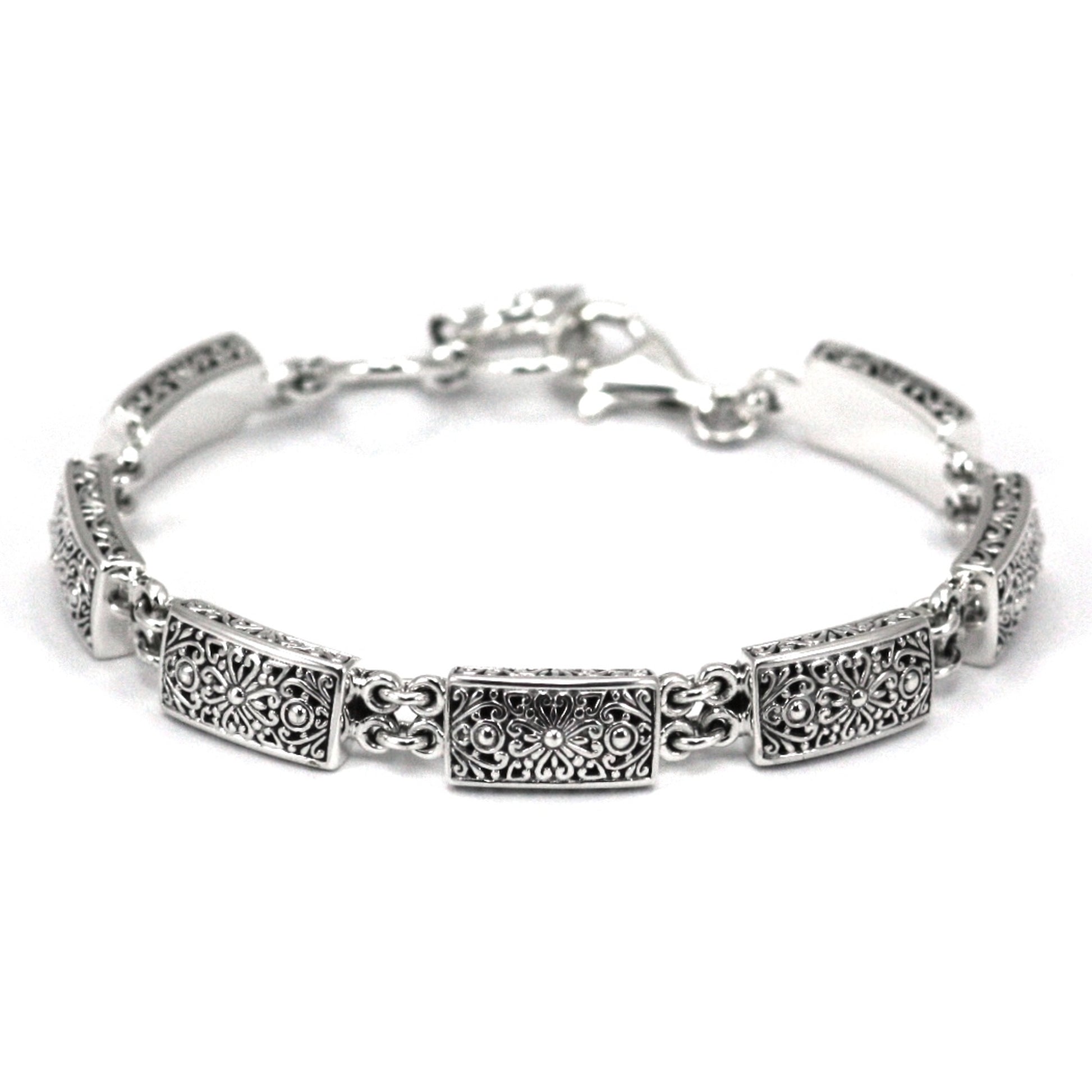 Silver bracelet made of rectangular cast links, with double ring linkage.