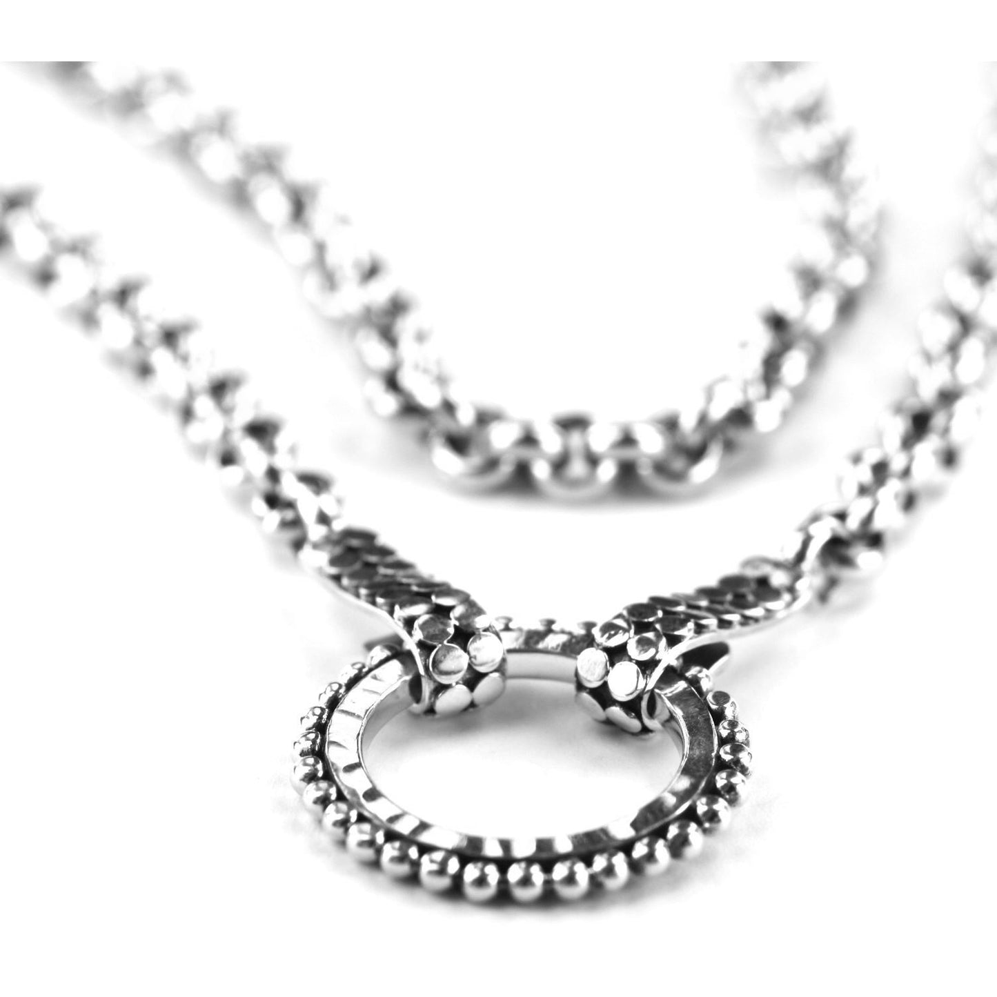 Rolo sterling silver necklace with a hammered center ring.