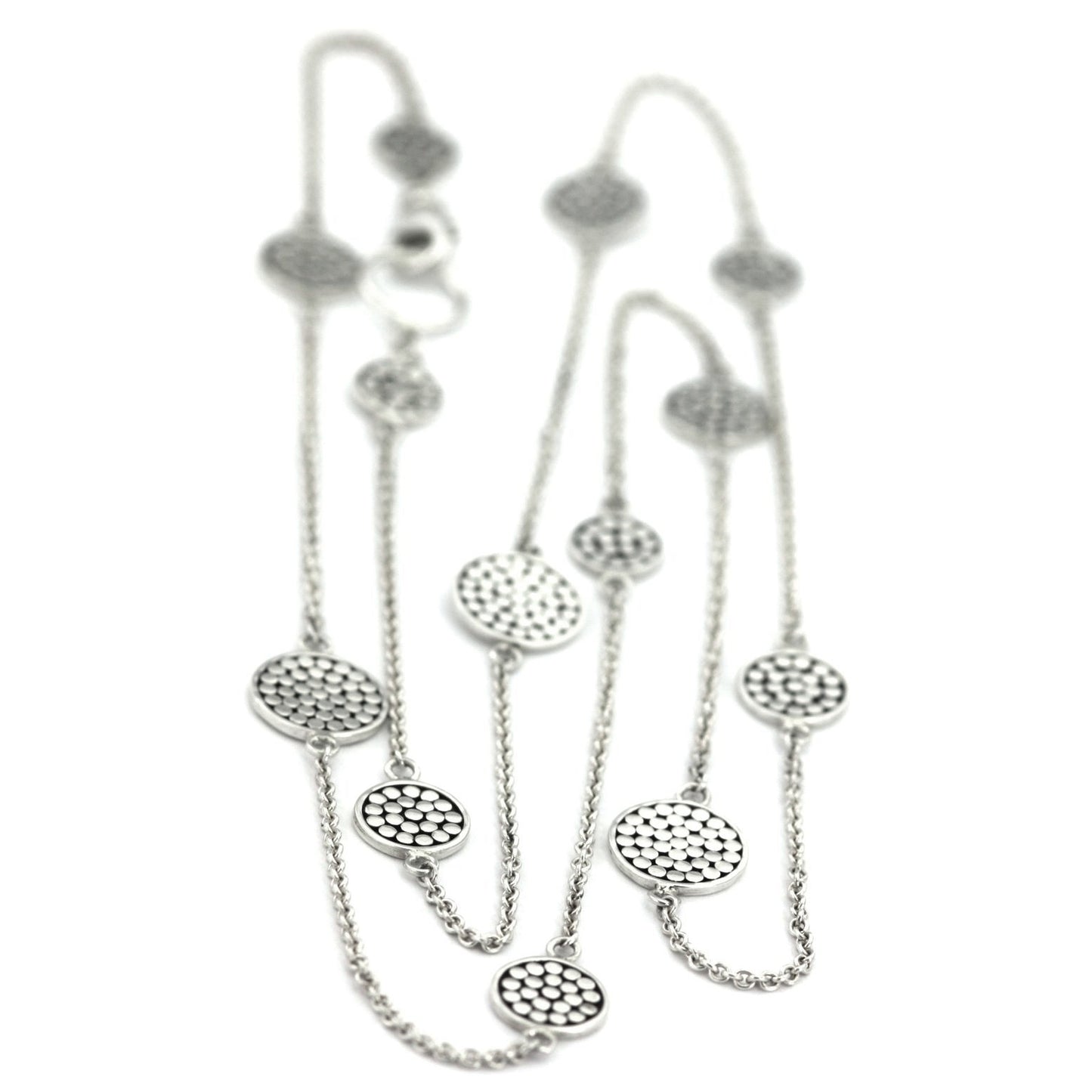 Sterling silver necklace with lightweight chain and dotted discs.