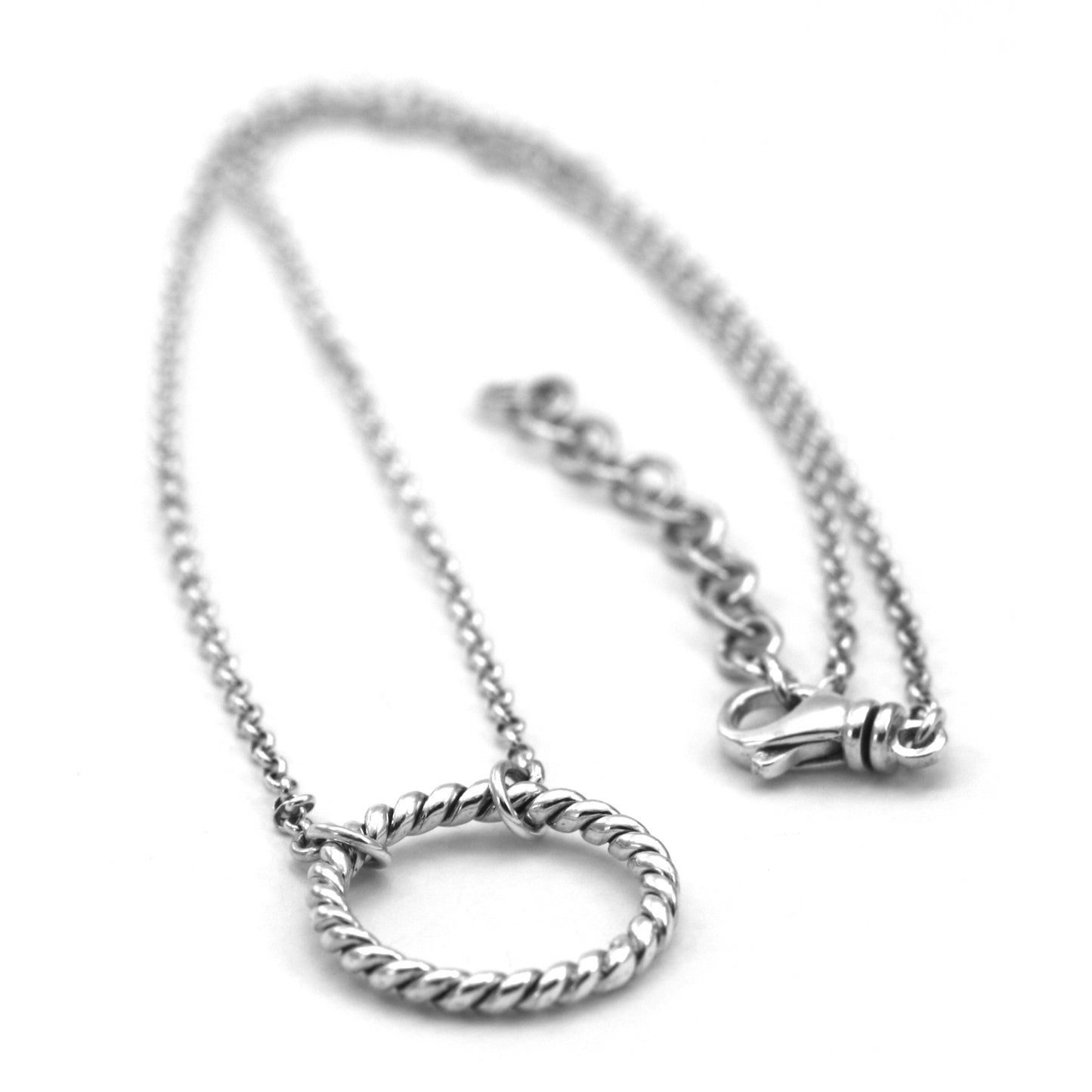 Sterling silver necklace with lightweight chain and a twisted ring station.