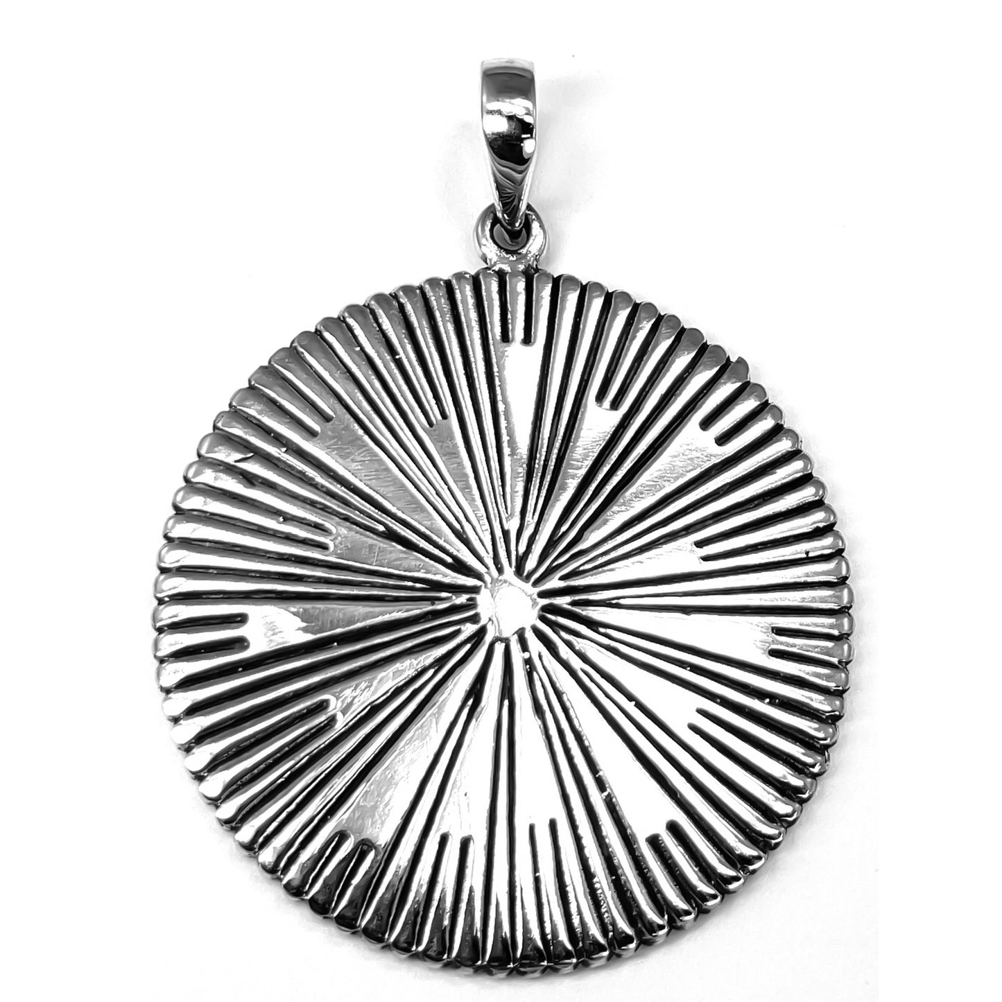 Sterling silver sun motif pendant.