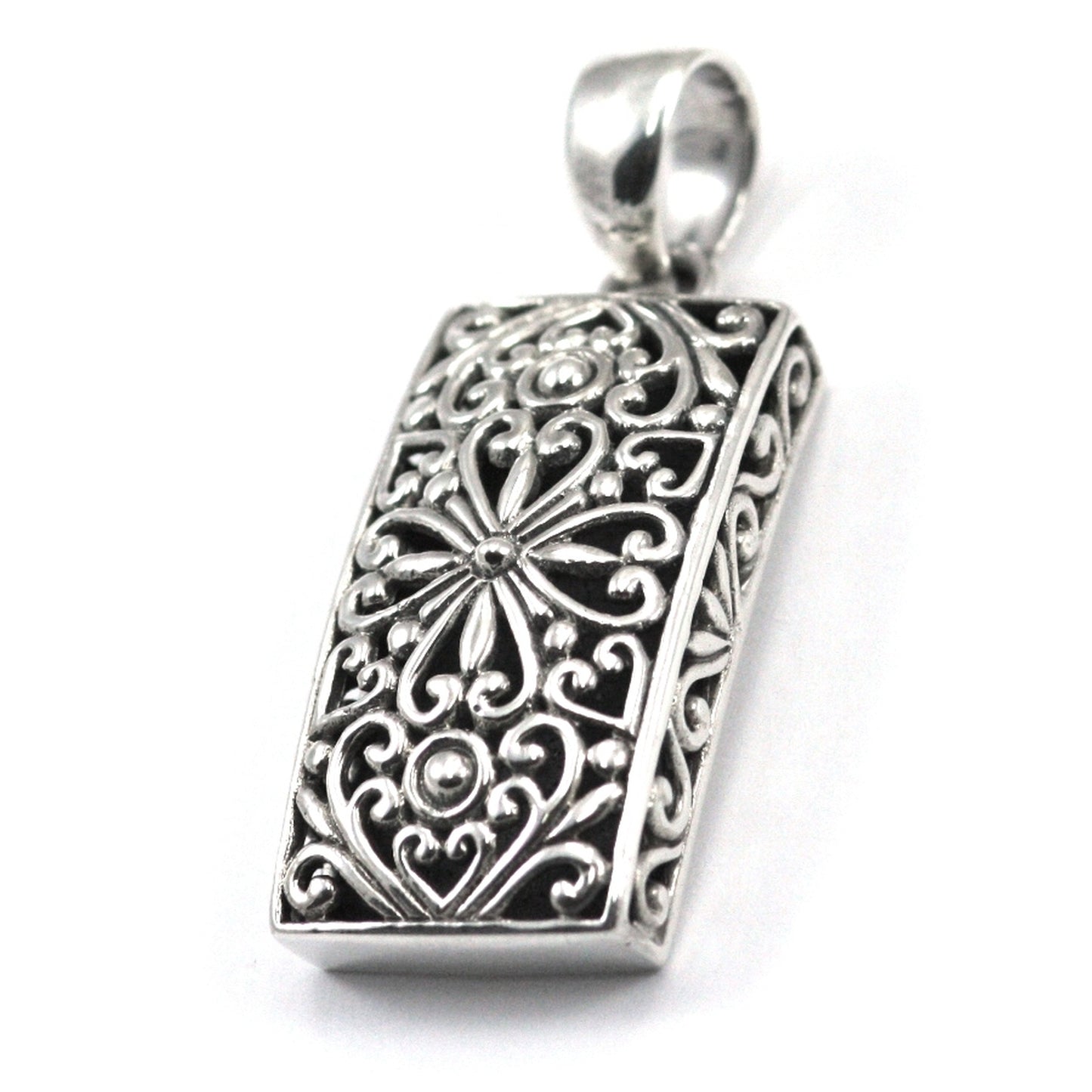 Sterling silver rectangular floral pendant.