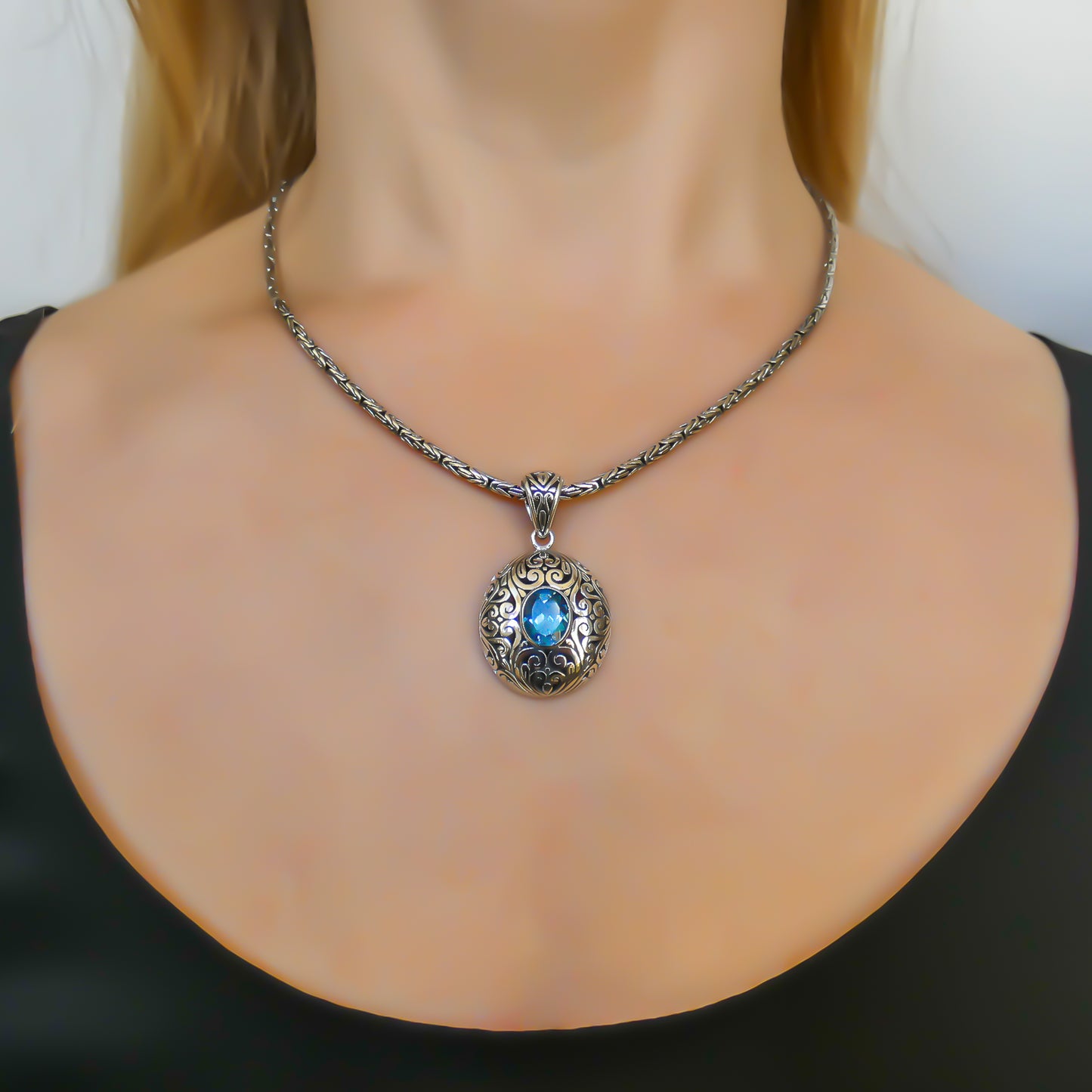 Sterling silver and blue topaz pendant.