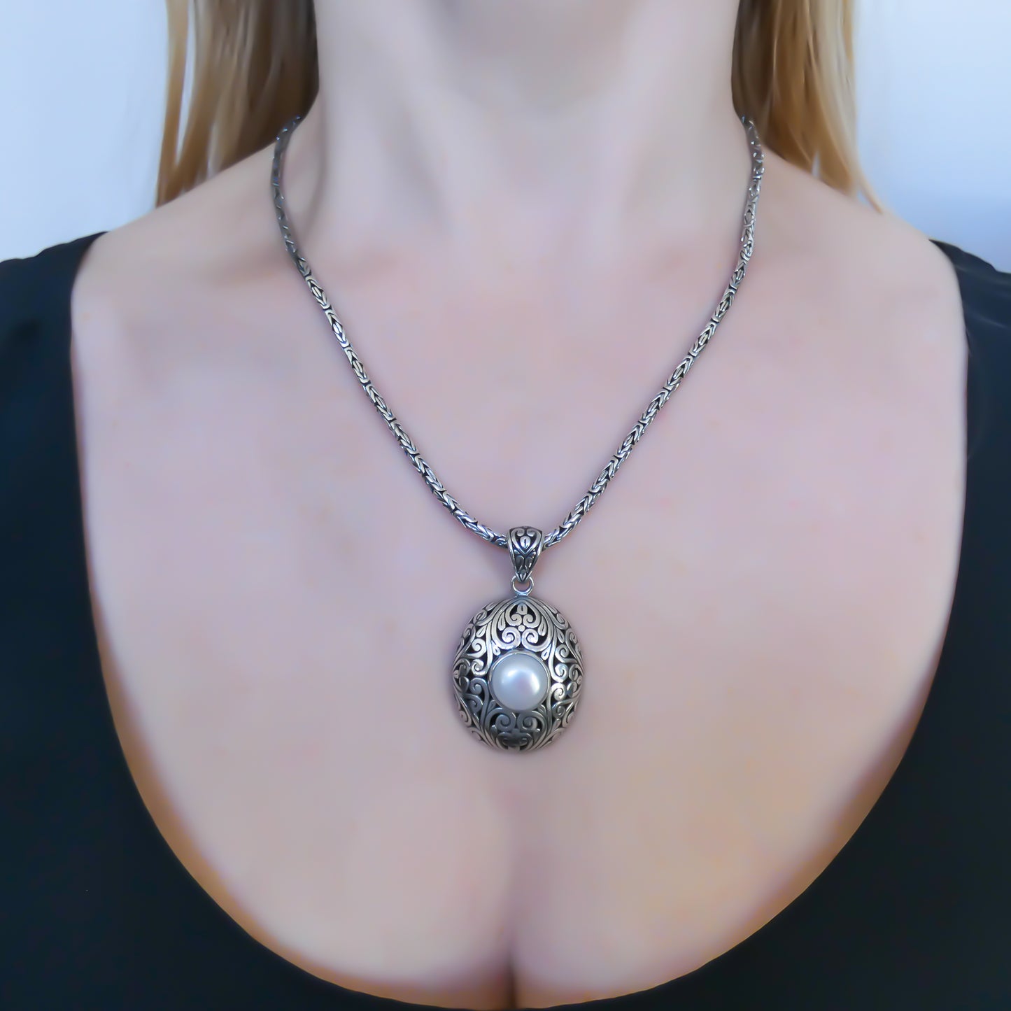 Sterling silver and pearl pendant.