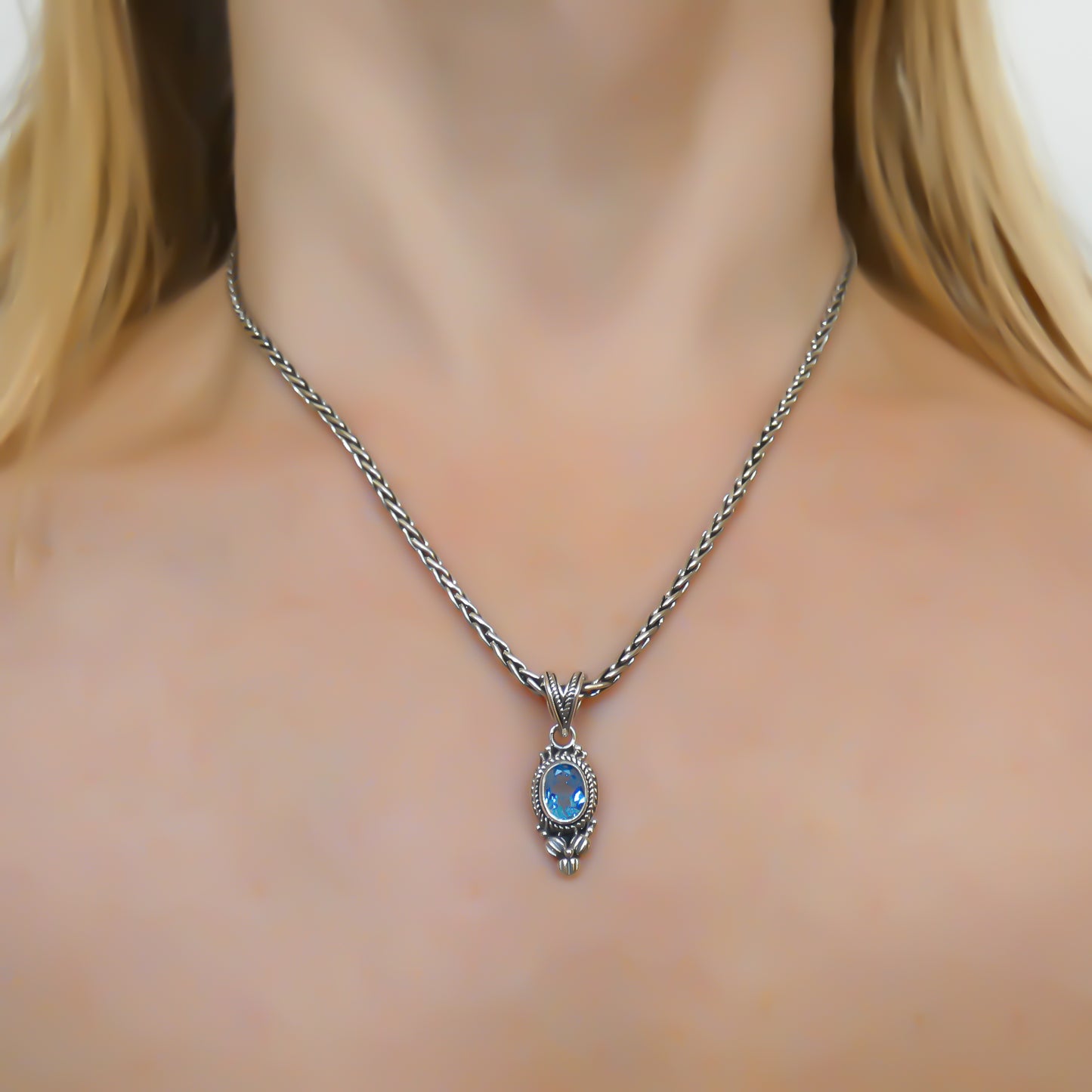 Sterling silver and blue topaz pendant.