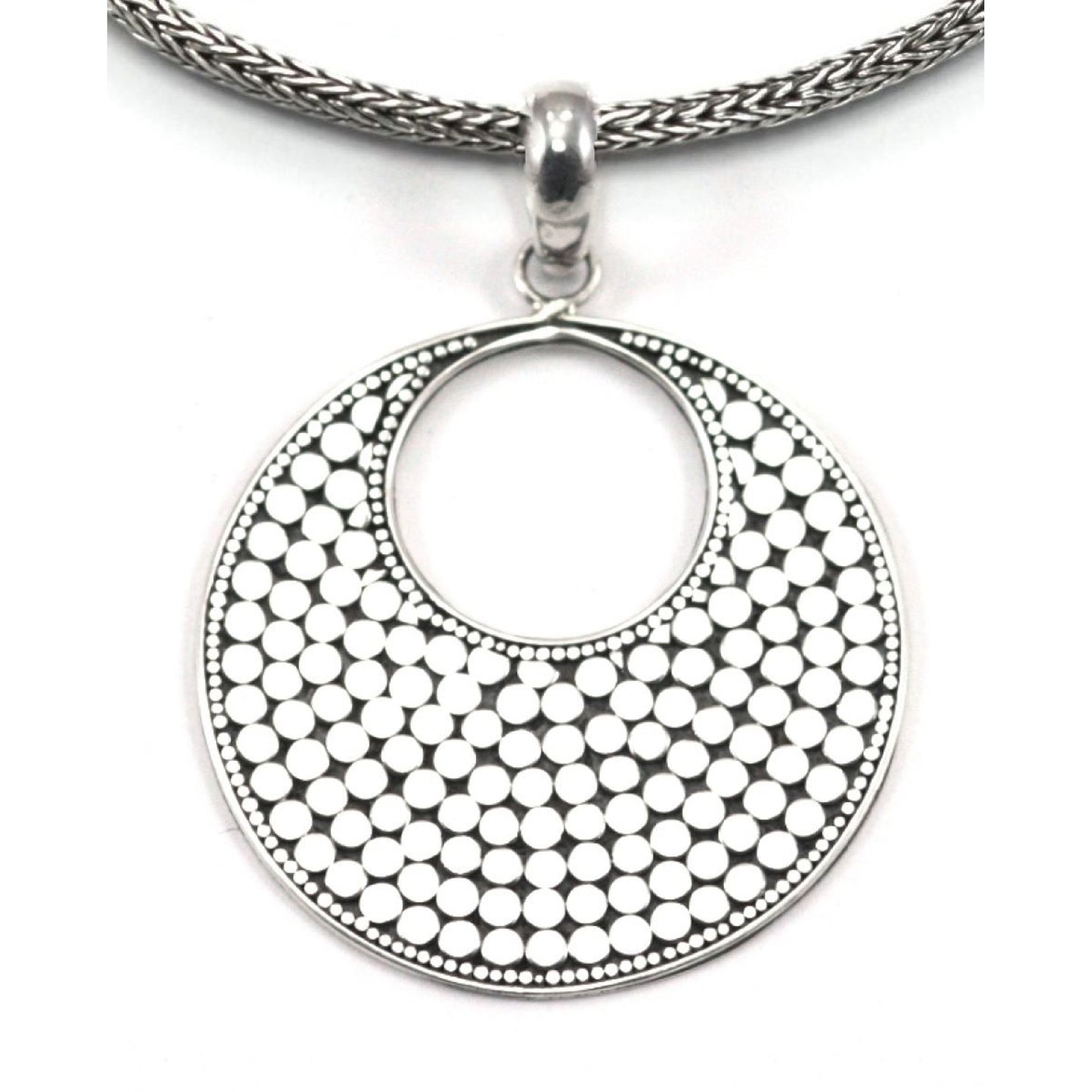Sterling silver dotted disc pendant.