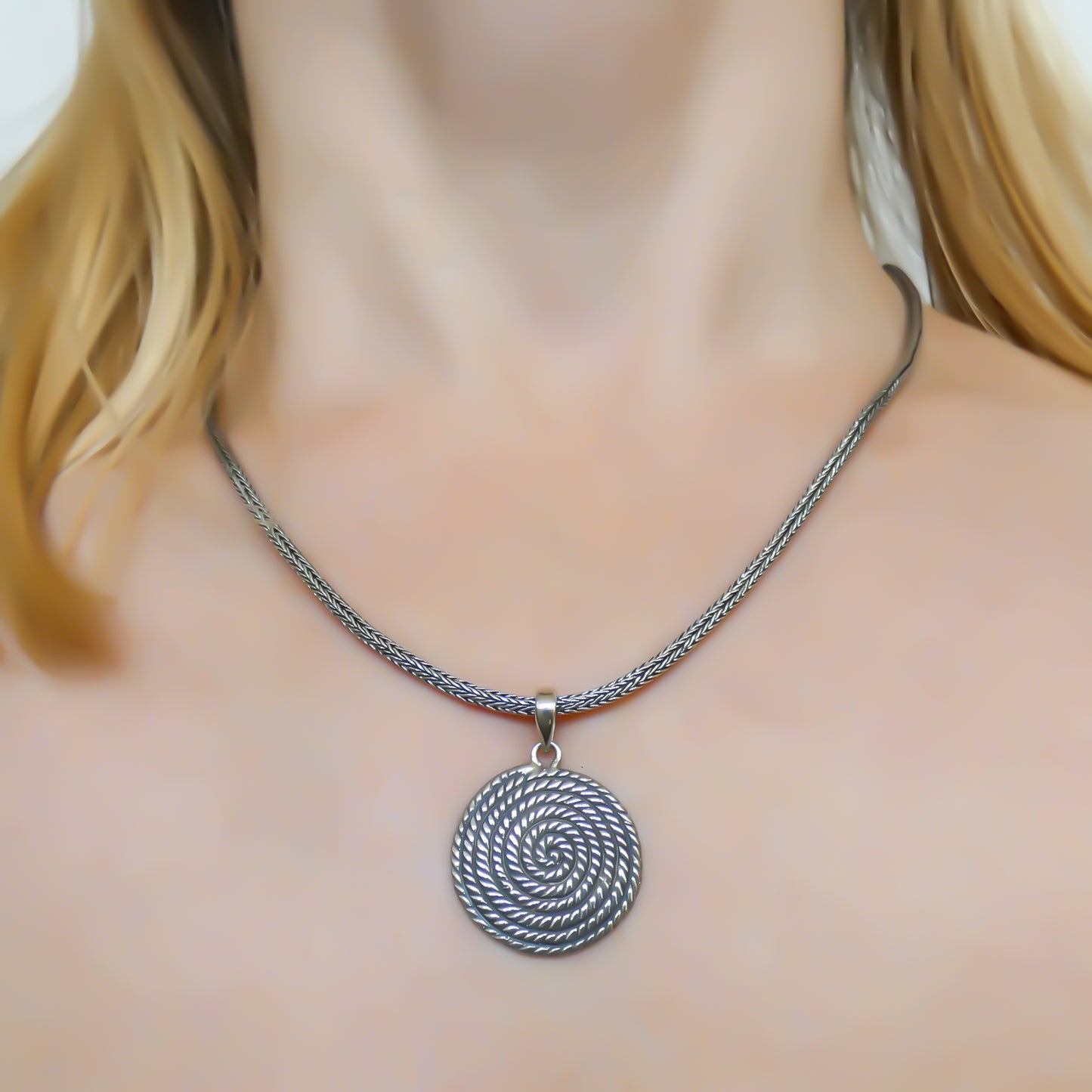 Sterling silver spiral pendant.