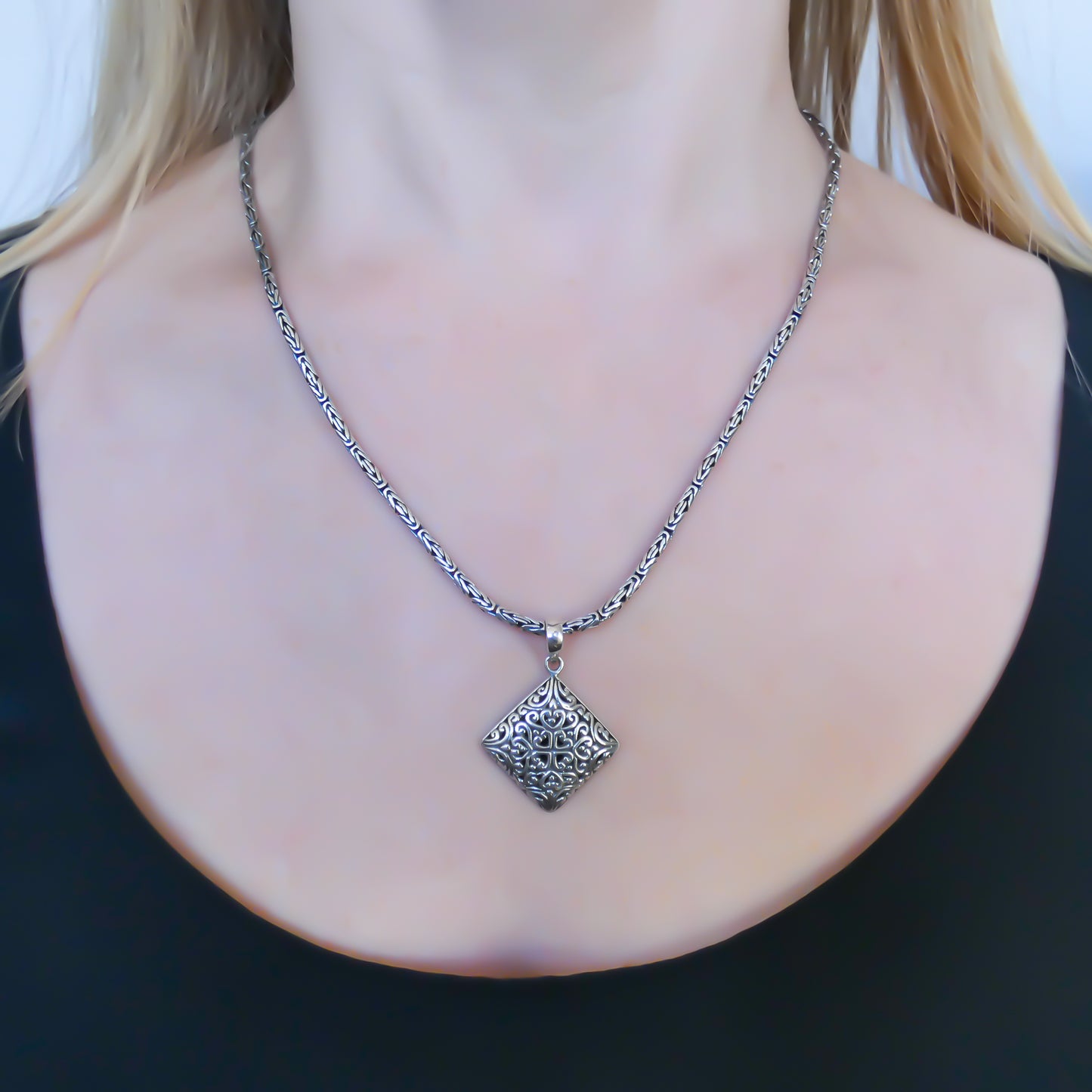 Sterling silver filigree pendant.