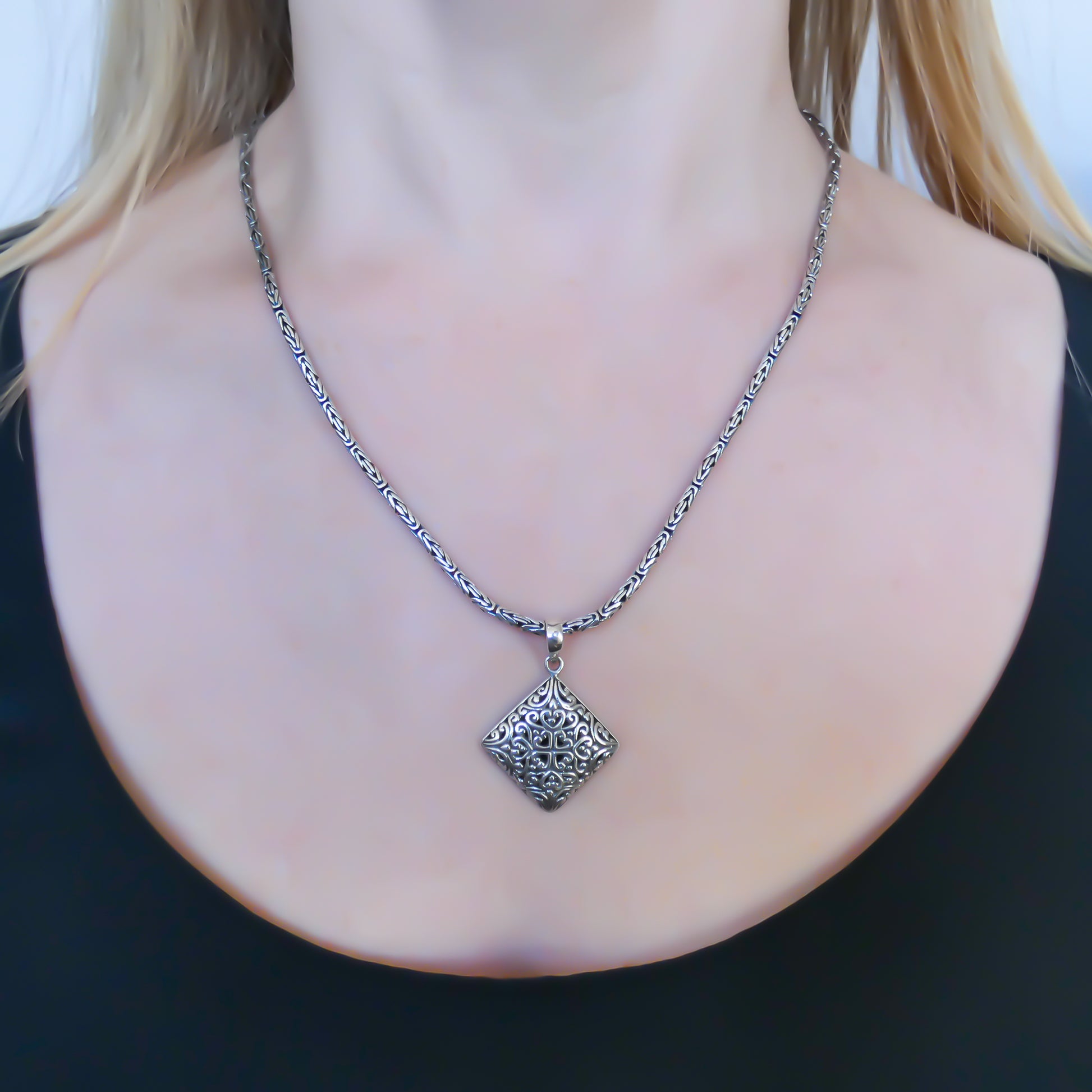 Sterling silver filigree pendant.