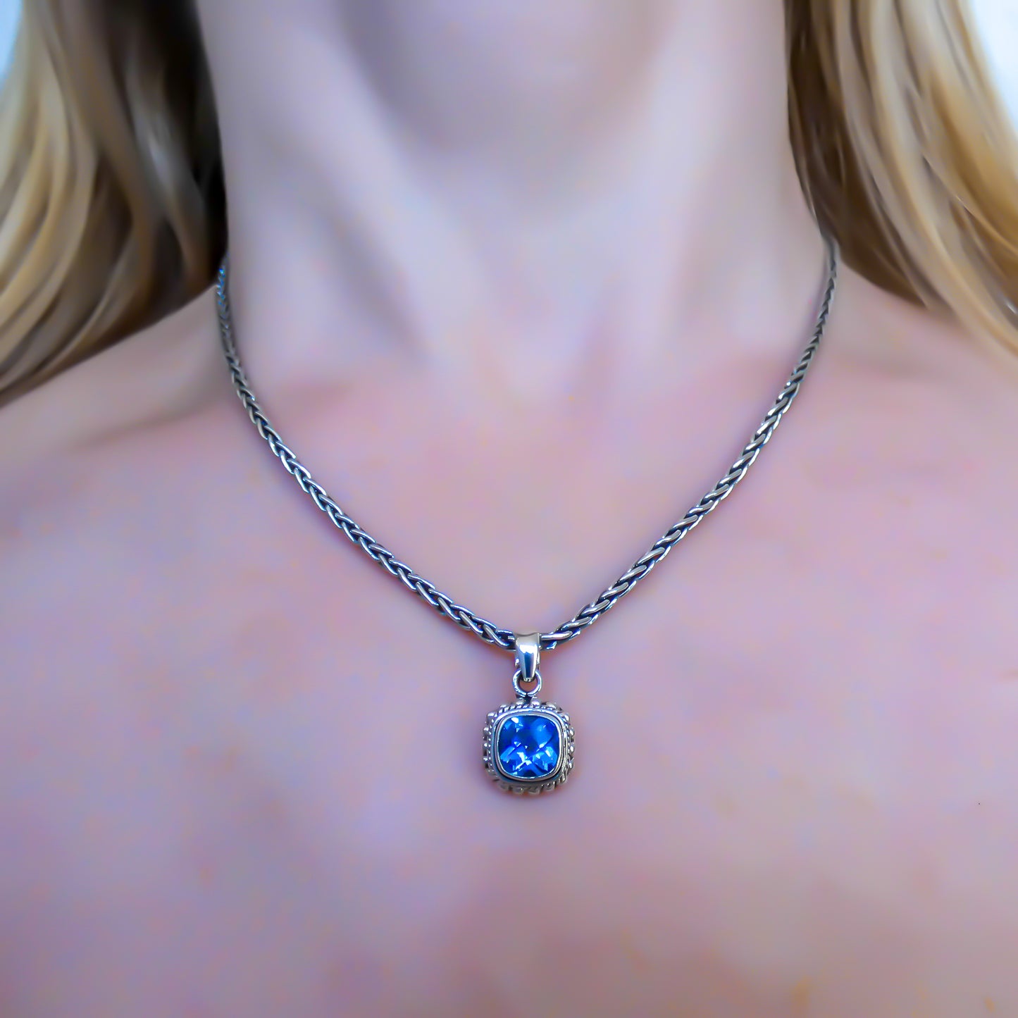 Sterling silver and square blue topaz pendant.