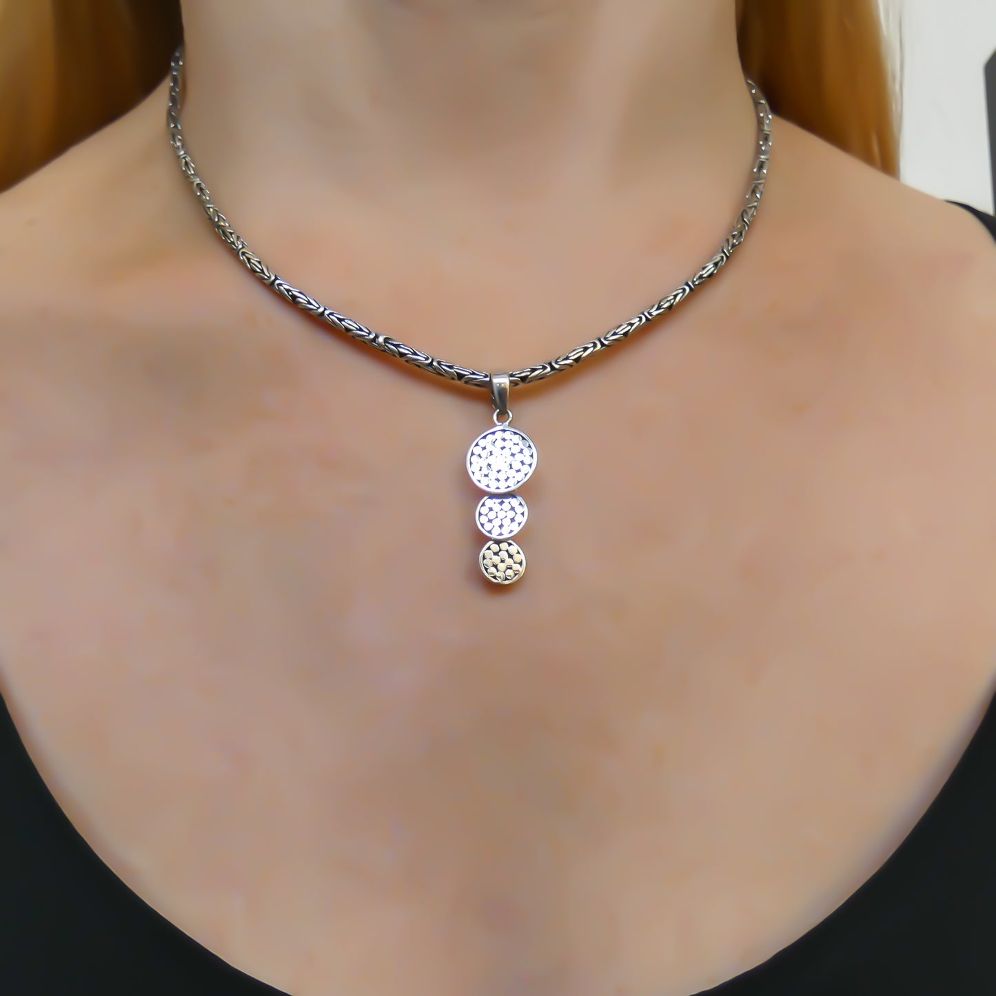 Sterling silver dangle pendant.