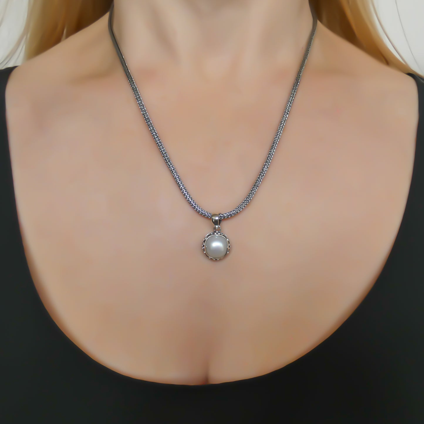 Sterling silver and pearl pendant.