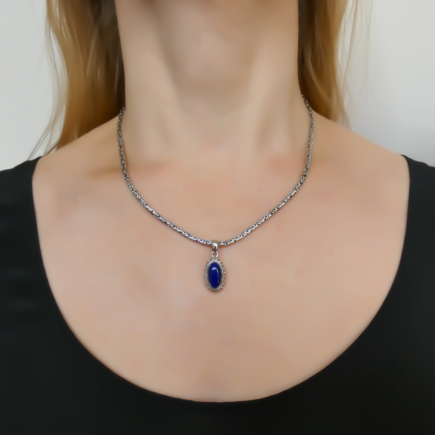 Sterling silver and lapis pendant.