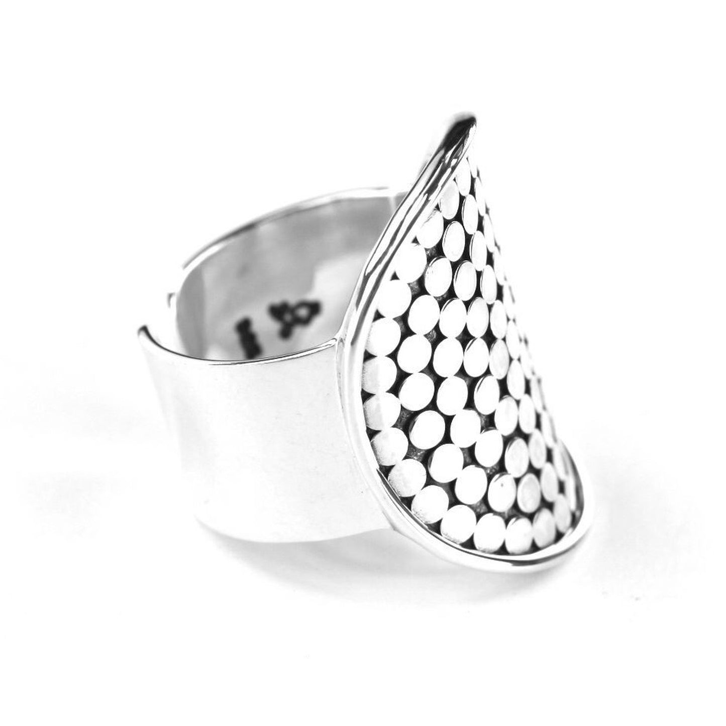 Sterling silver ring with handmade design motif.