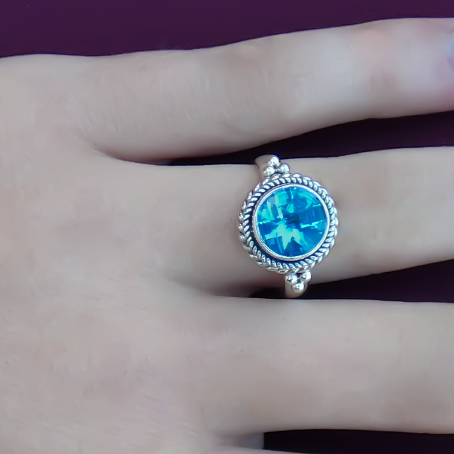 Sterling silver and blue topaz ring.