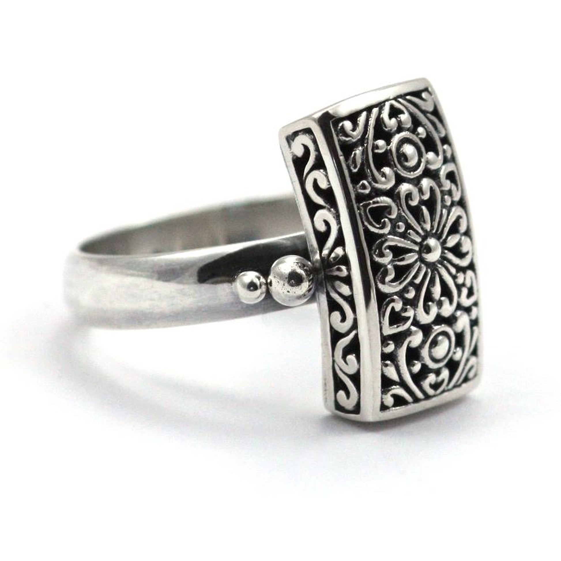 Sterling silver ring with handmade design motif.