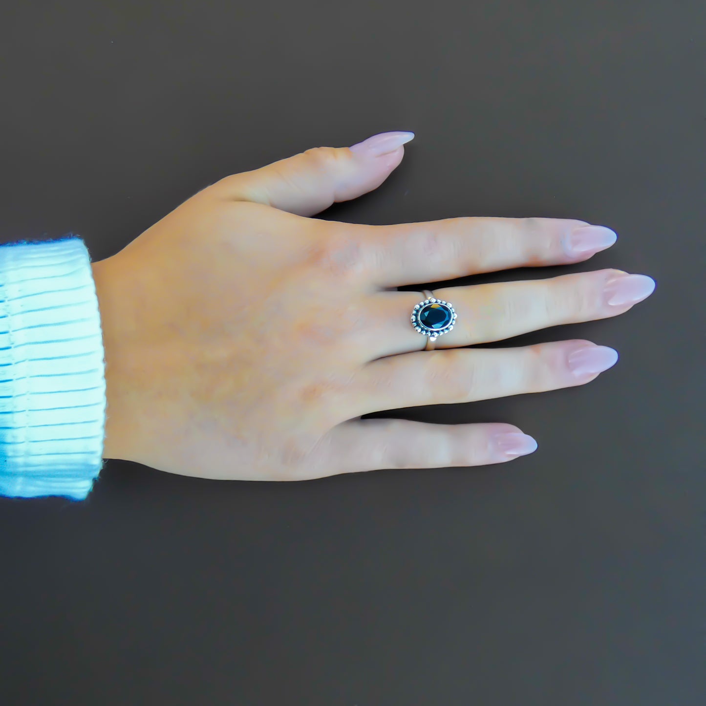 Sterling silver and faceted onyx ring.