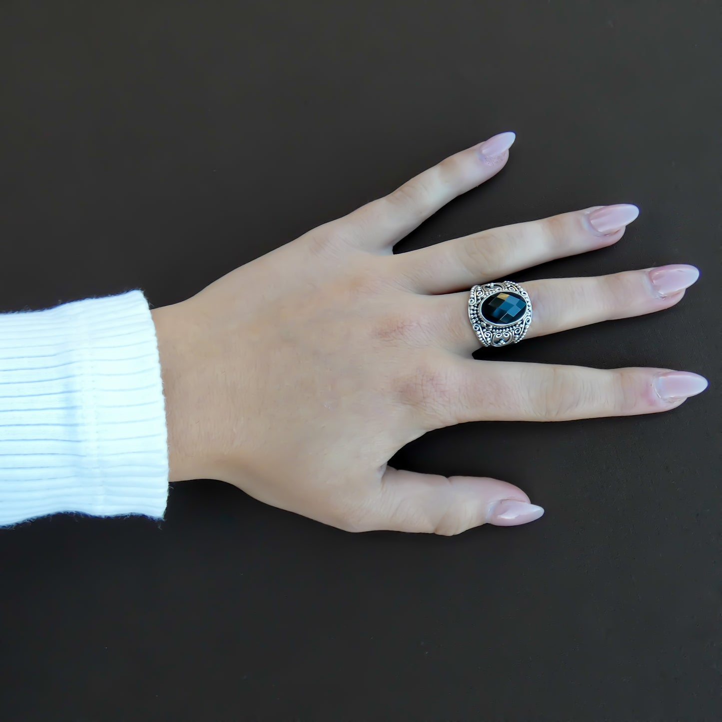Sterling silver and faceted black onyx ring.