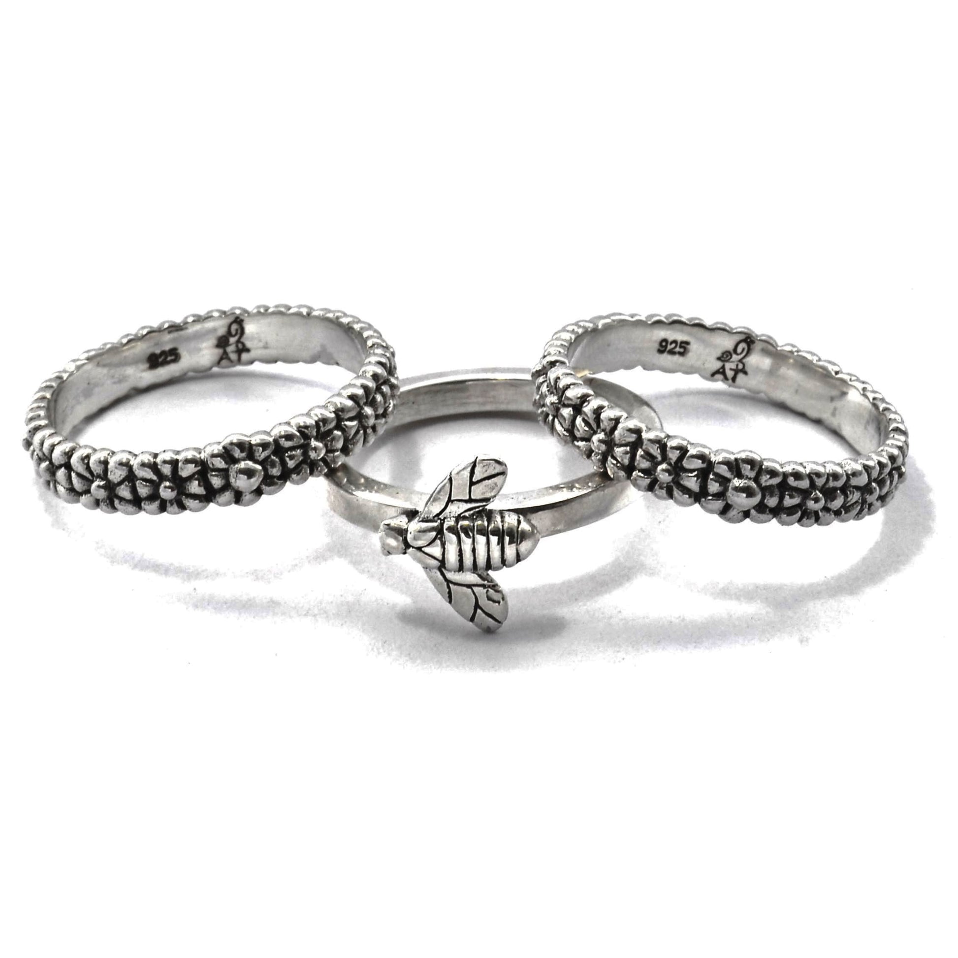 Sterling silver ring set with bee motif.