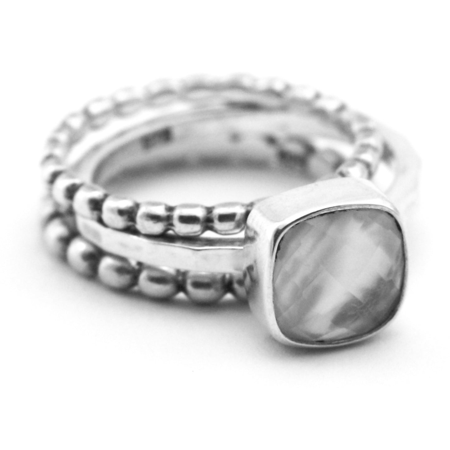 Sterling silver and mother of pearl doublet ring set.