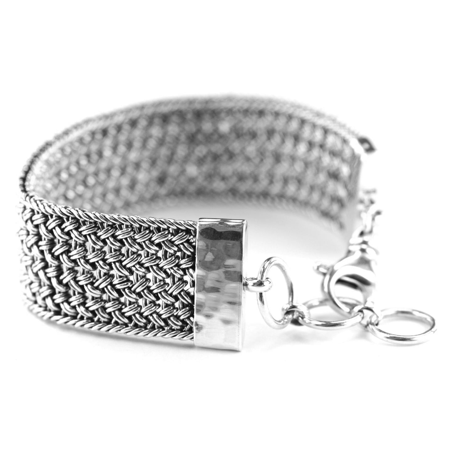 Wide braided silver wire bracelet with hammered end caps and a lobster clasp.