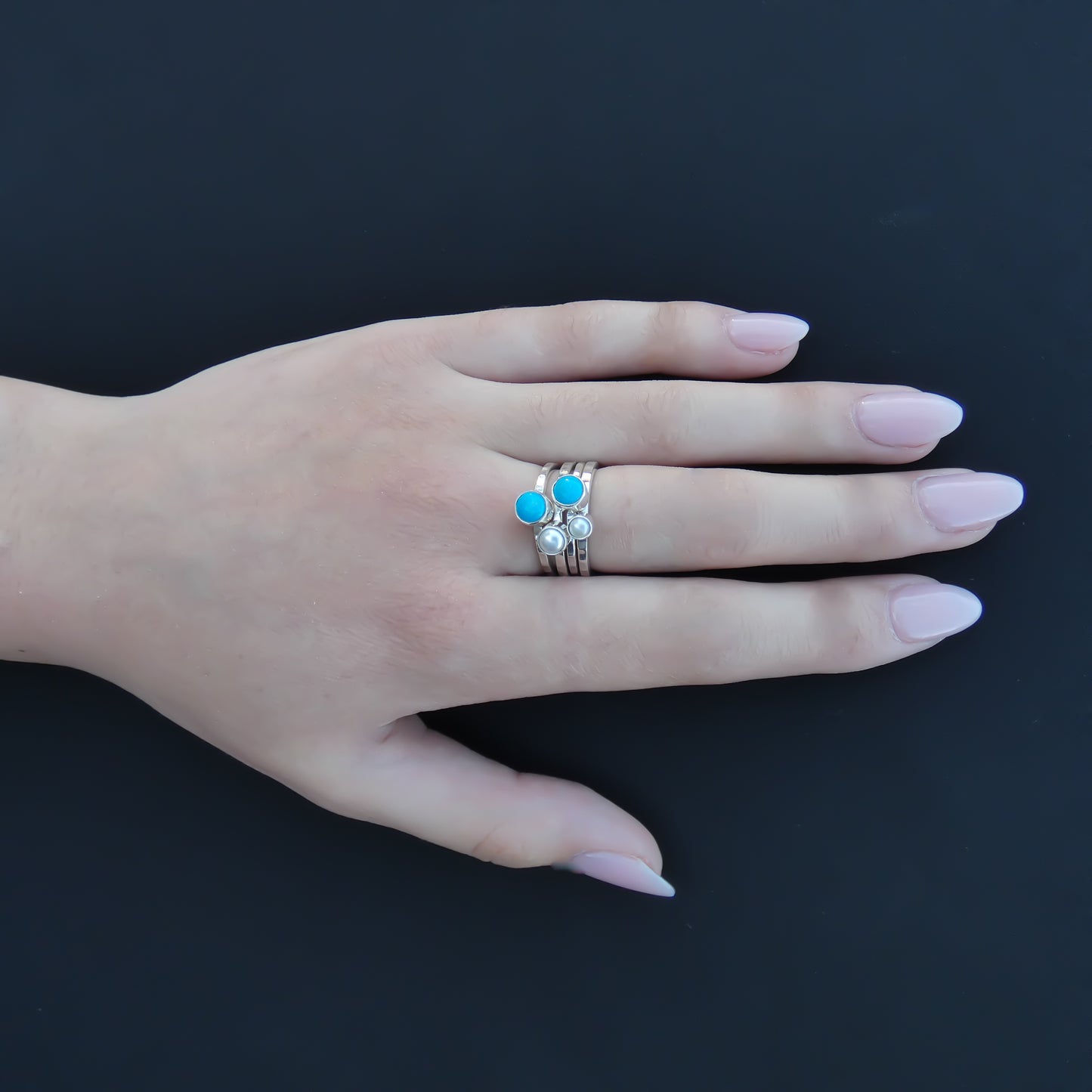 Sterling silver ring set with pearls and turquoise.
