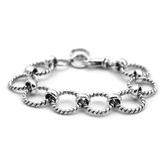 Silver bracelet made of eight round twisted ring links.