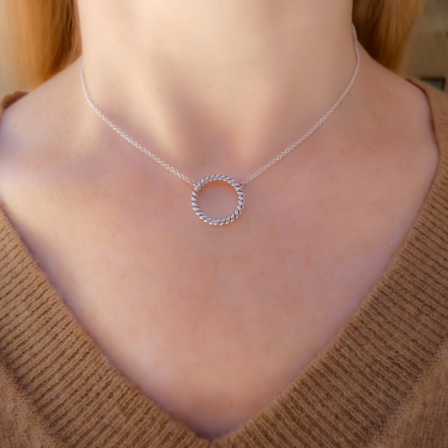 Sterling silver necklace with lightweight chain and a twisted ring station.