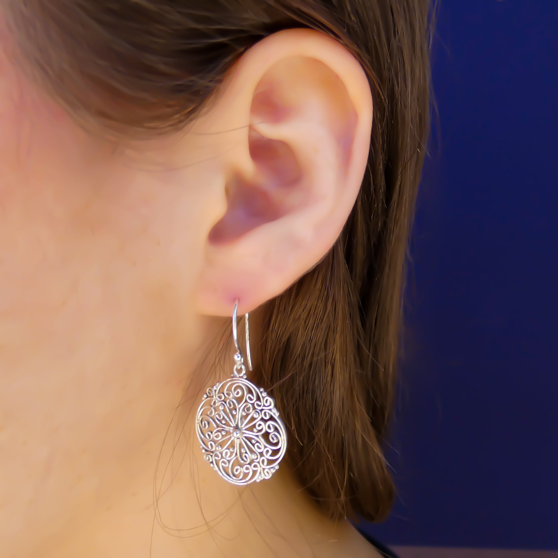 Sterling silver wire filigree round earrings.