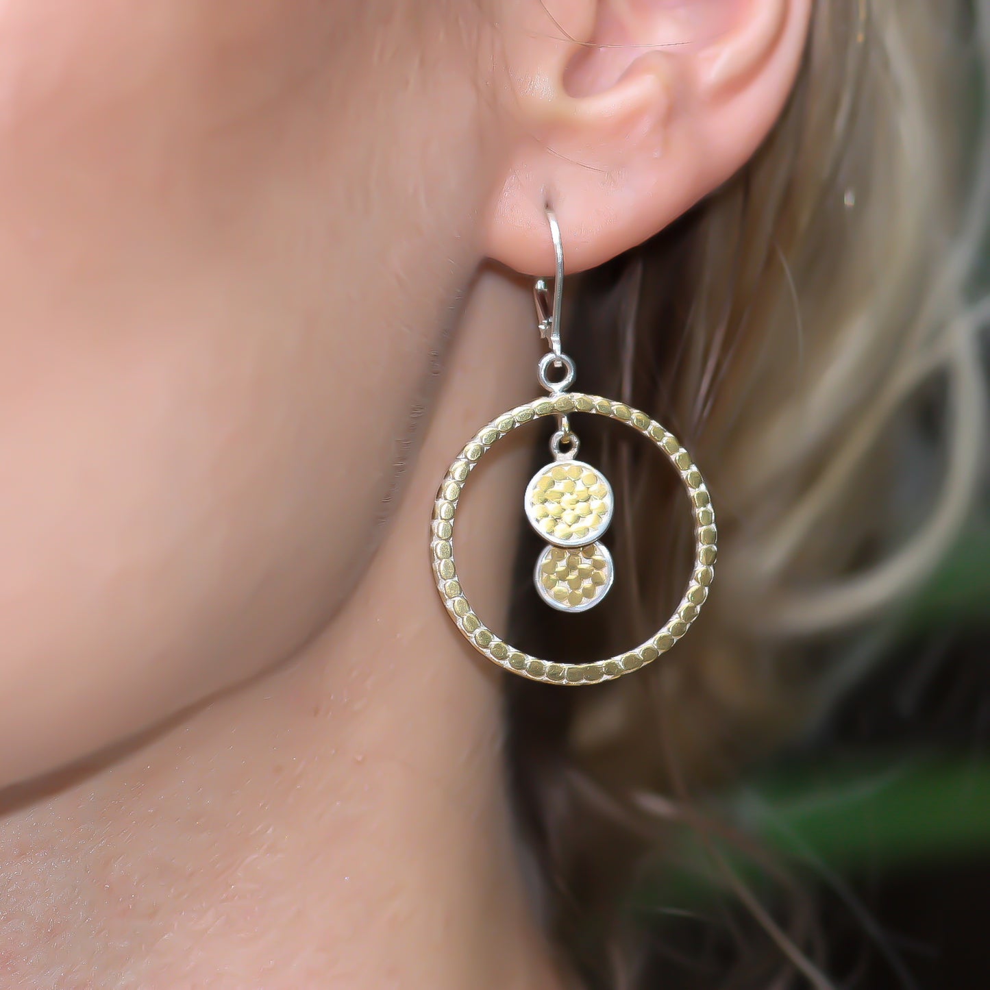 Stering silver and gold ring and disc drop earrings.