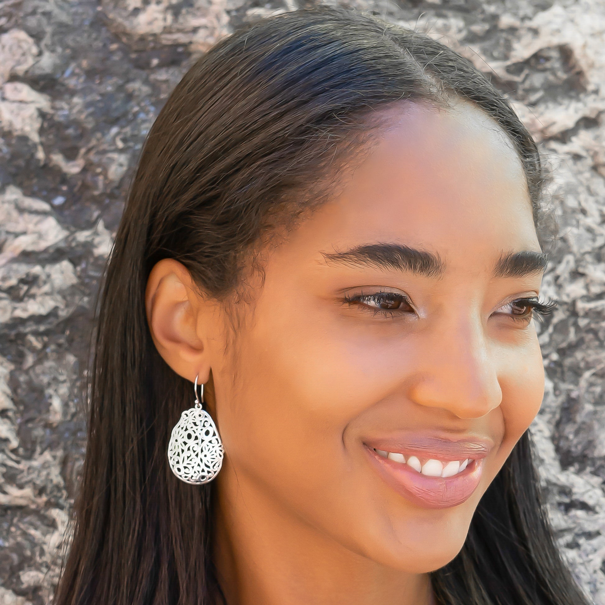 Sterling silver floral dangle earrings.