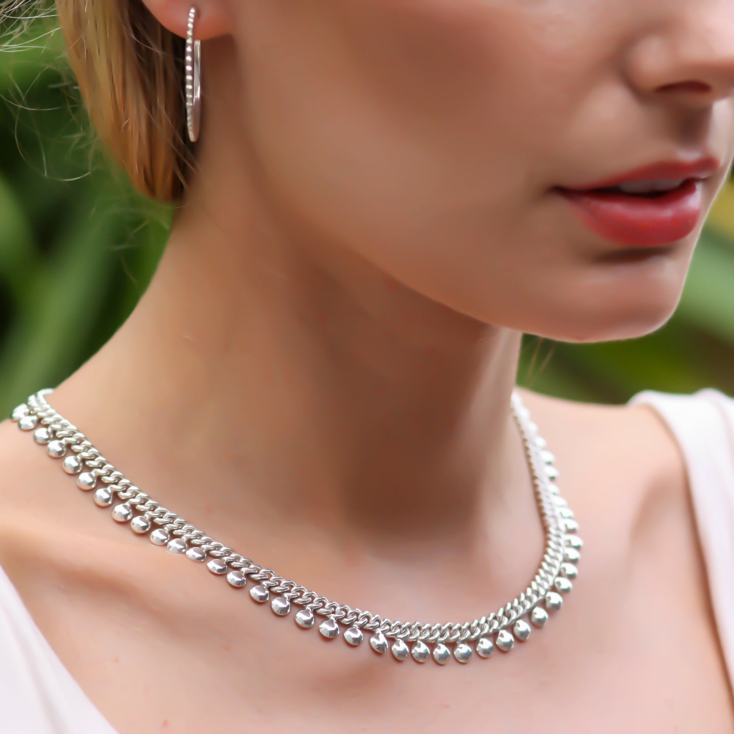 Beaded flowing sterling silver necklace.