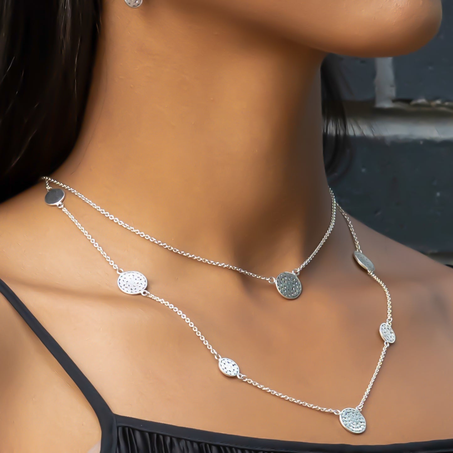 Sterling silver necklace with lightweight chain and dotted disc.